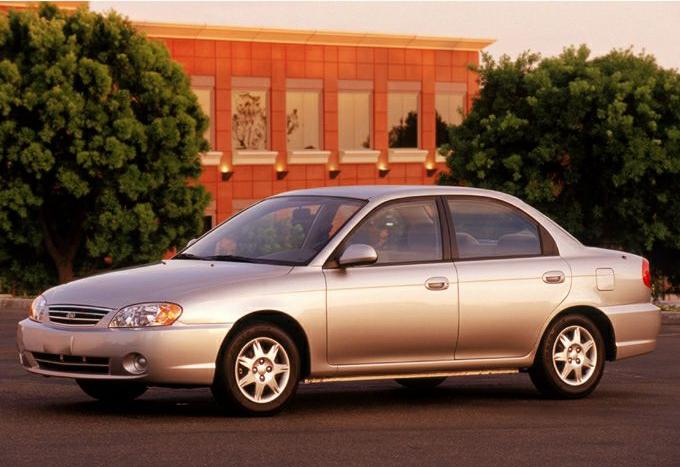 Silver compact sedan with alloy wheels in front-side view