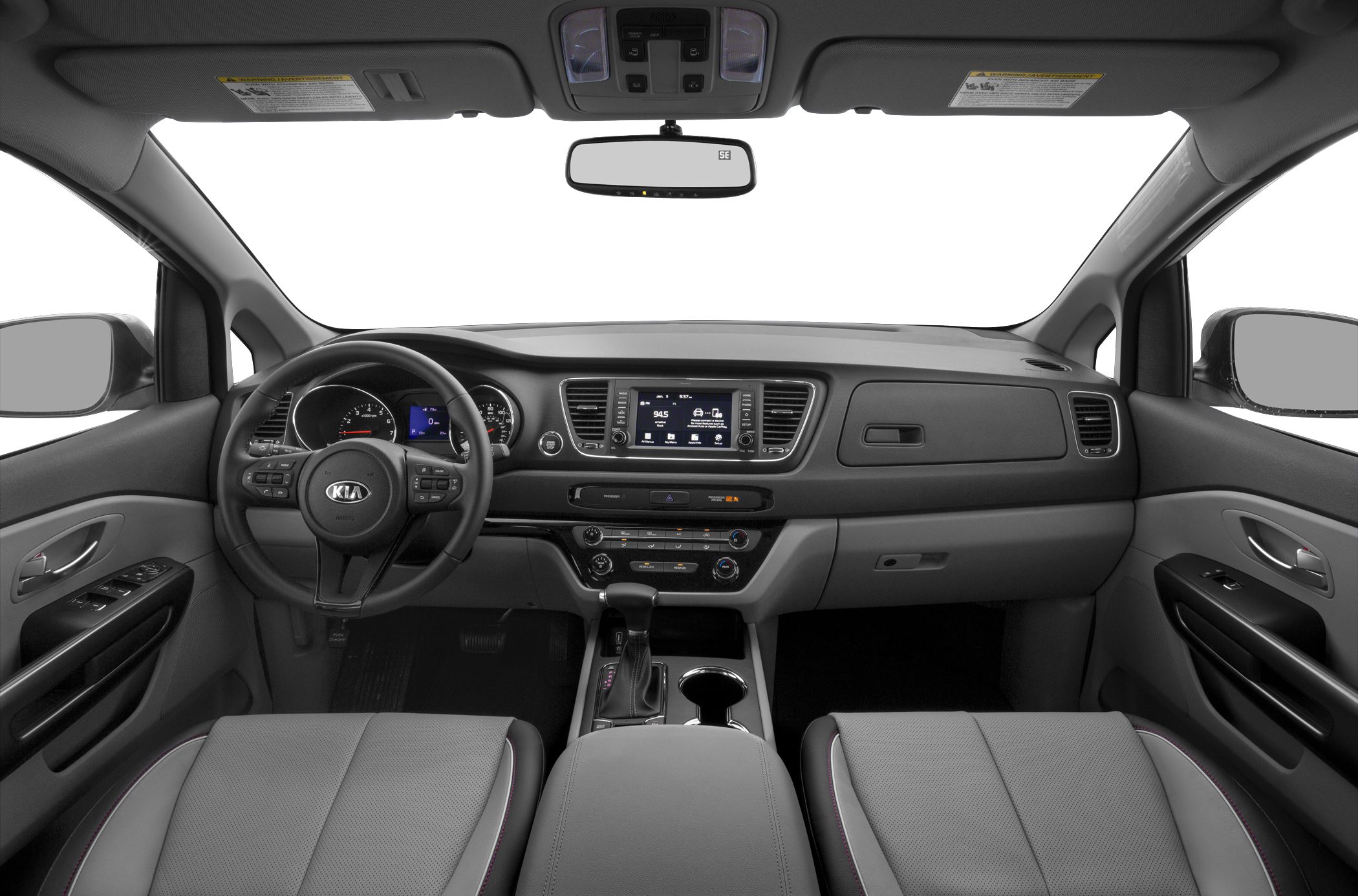 Car interior dashboard, steering wheel, and center console with infotainment