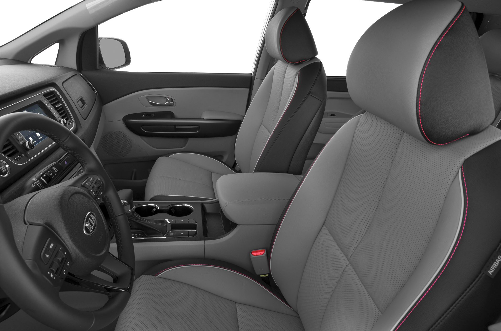 Front seats with red stitching and dashboard center console