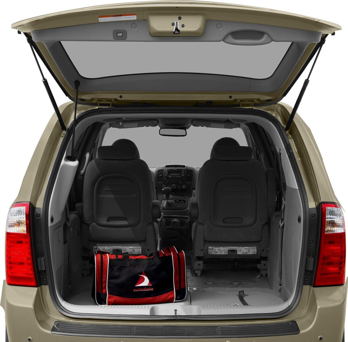 Open rear hatch showing cargo space and front seats of minivan