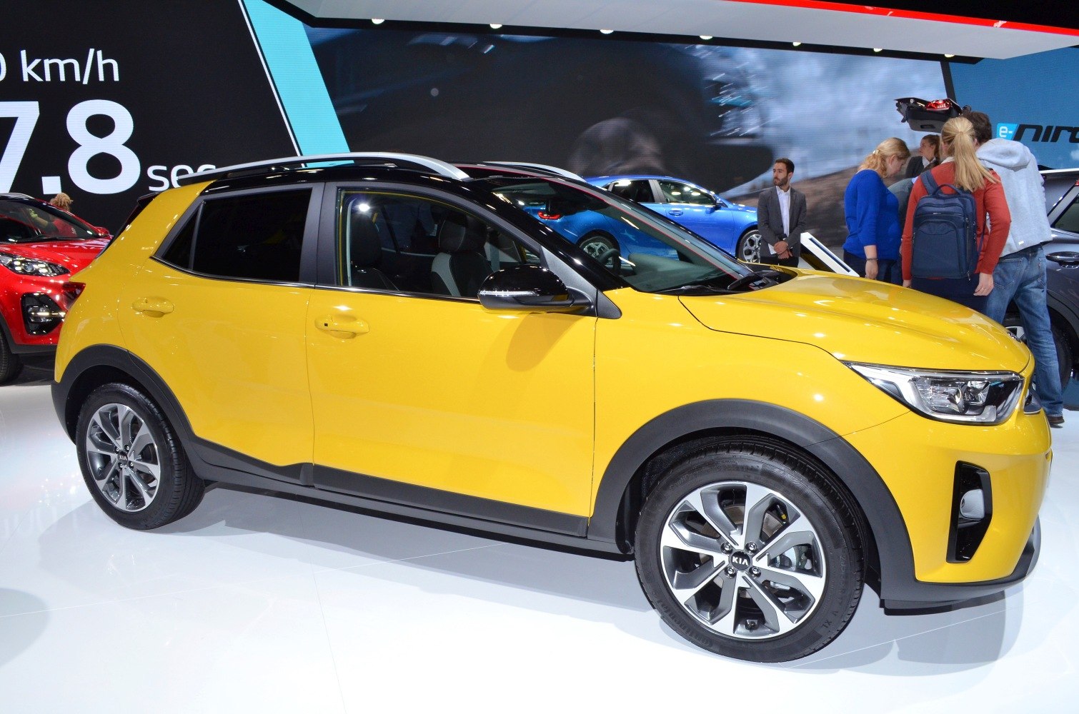 Yellow compact crossover SUV with alloy wheels and roof rails