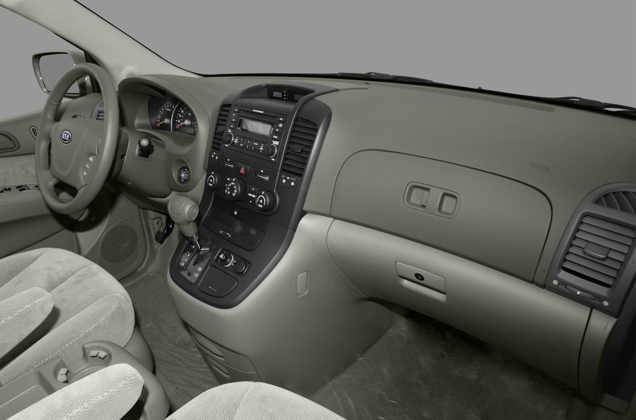 Dashboard, steering wheel, gear shift, and central console with climate controls