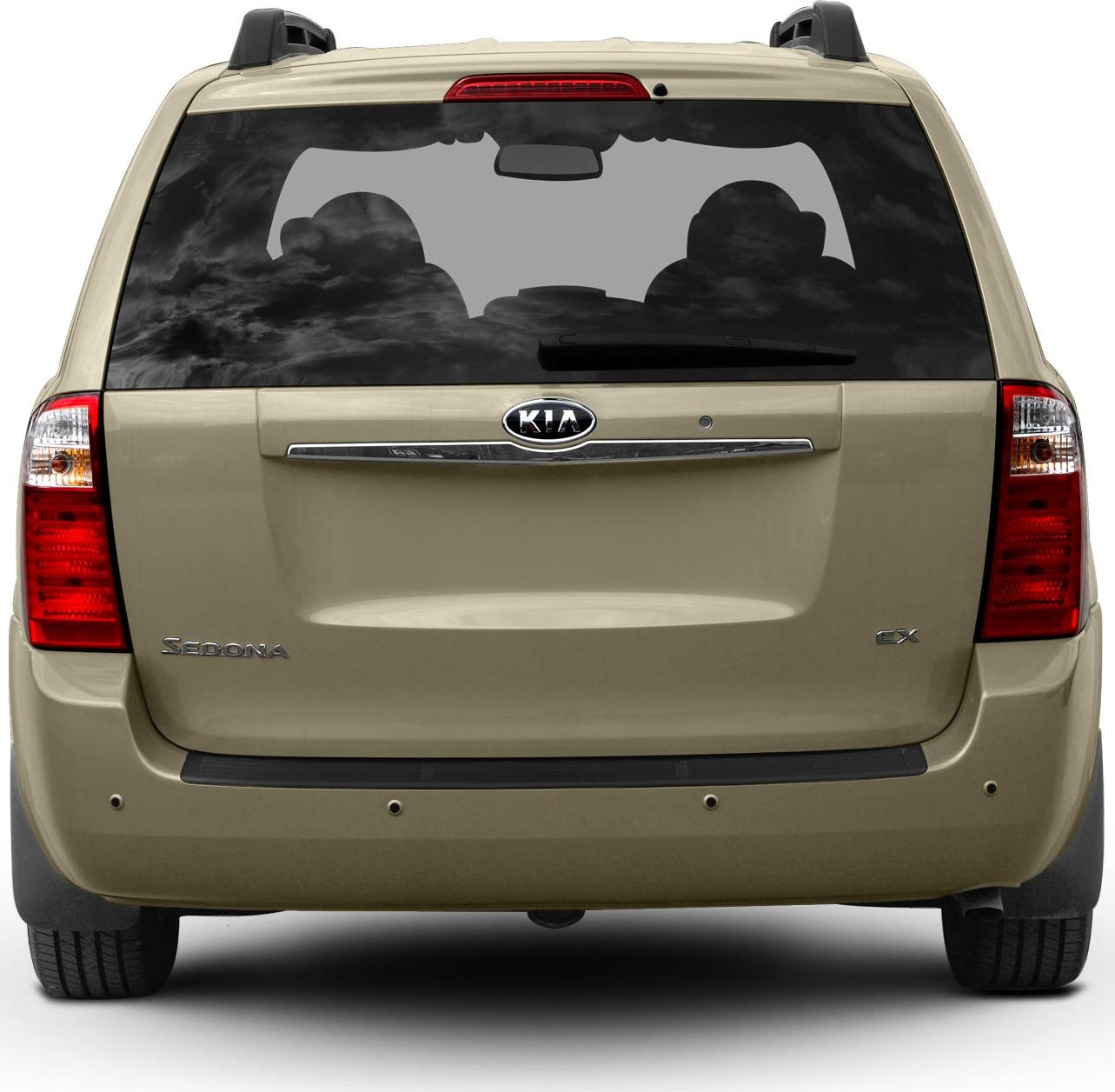 Rear view of minivan featuring tailgate, large rear window, and taillights