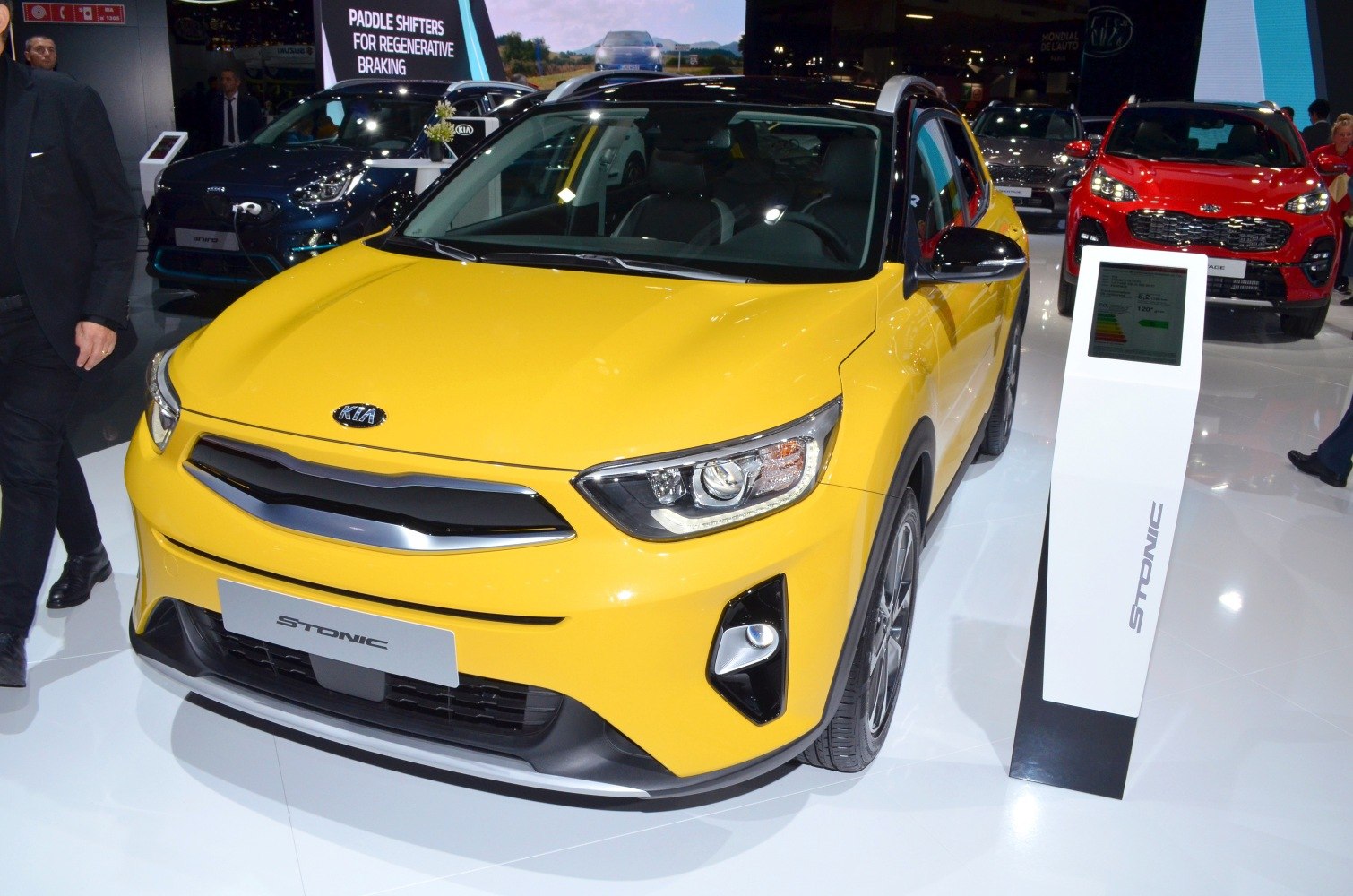 Front view of yellow compact SUV with sharp headlights and grille