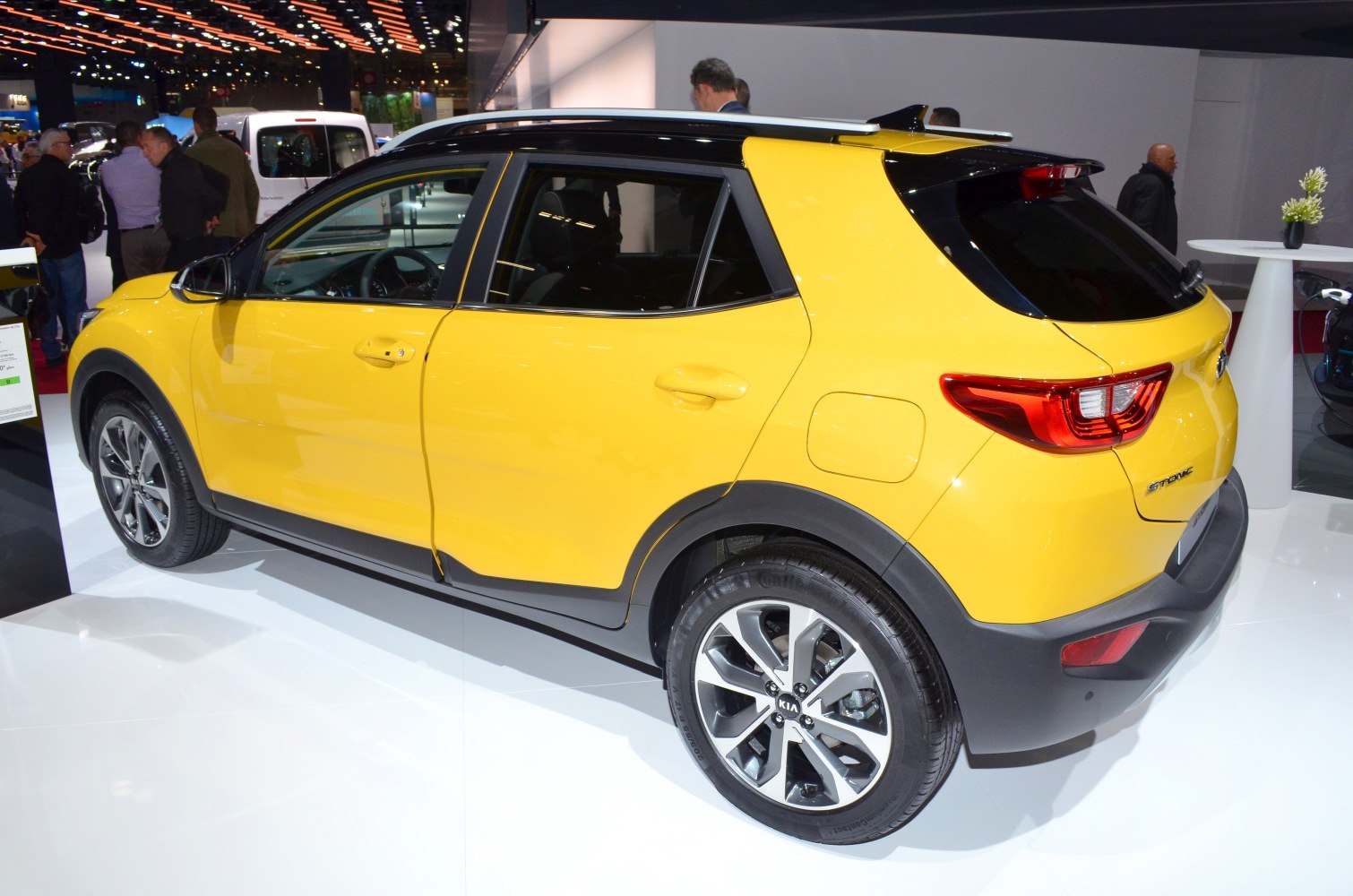 Yellow compact SUV rear side with alloy wheels and black roof