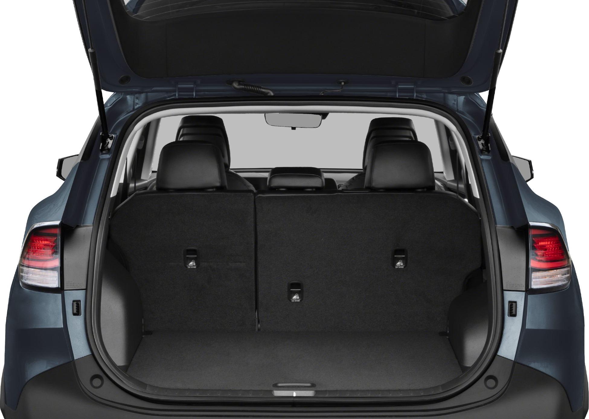 Open rear cargo area with folded seats and tailgate lifted