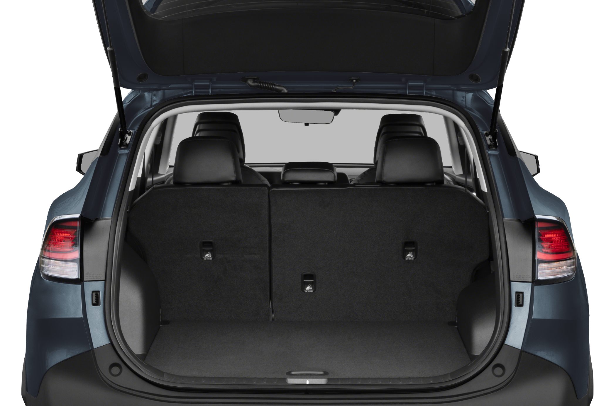 Spacious rear cargo area with upright rear seats in SUV.