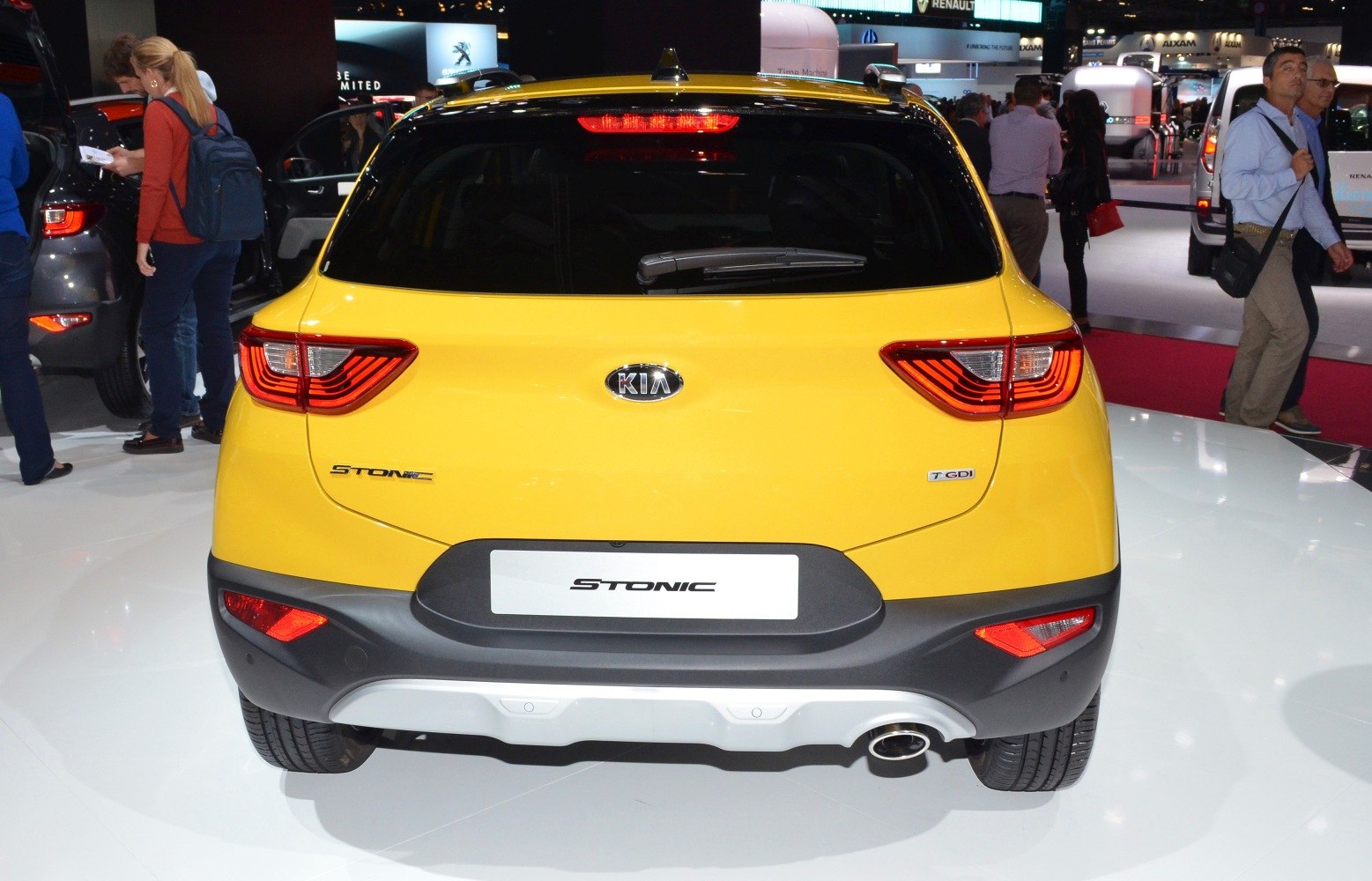Bright yellow compact SUV rear with LED tail lights and single exhaust