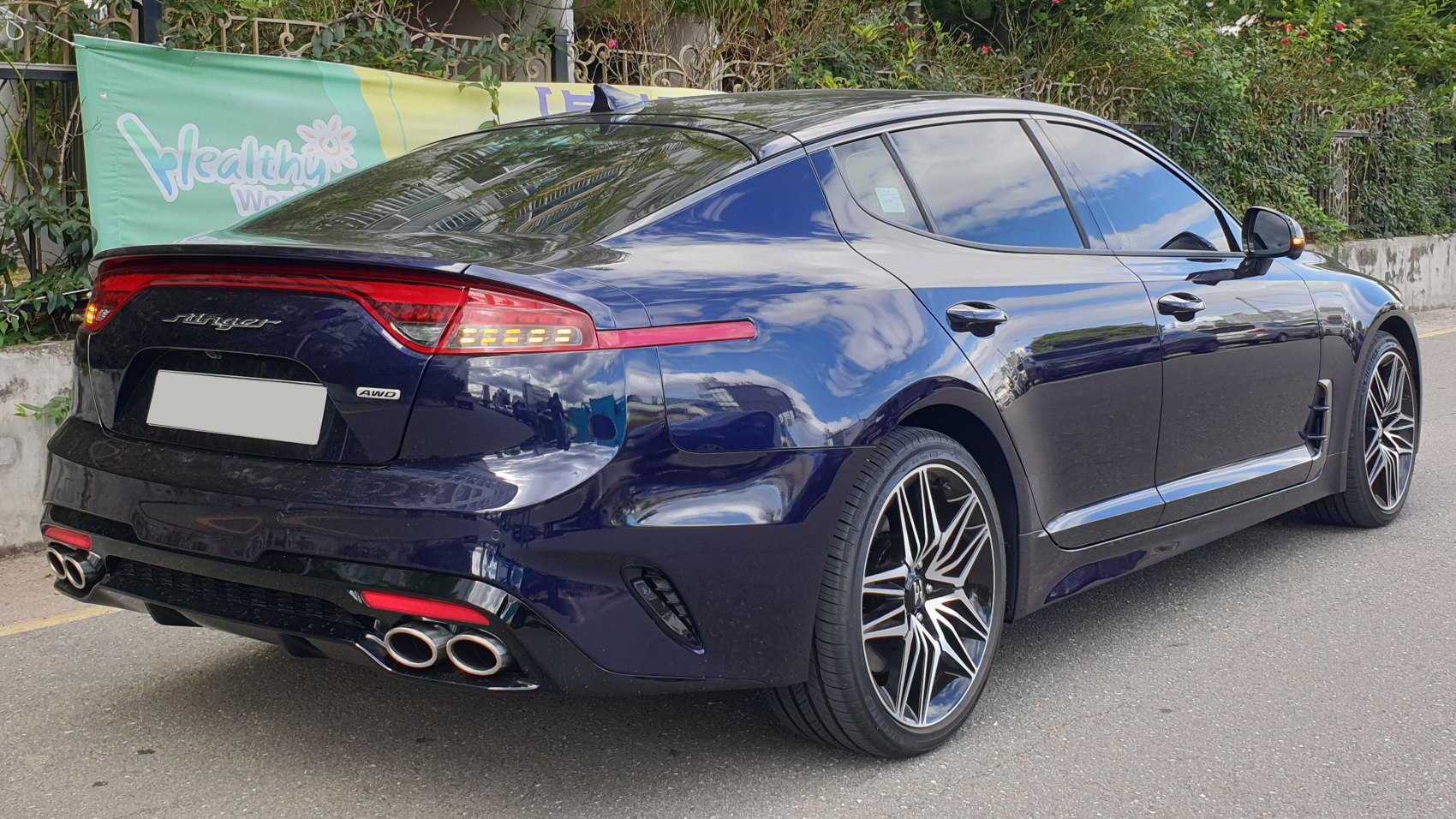 Rear view with quad exhaust and alloy wheels