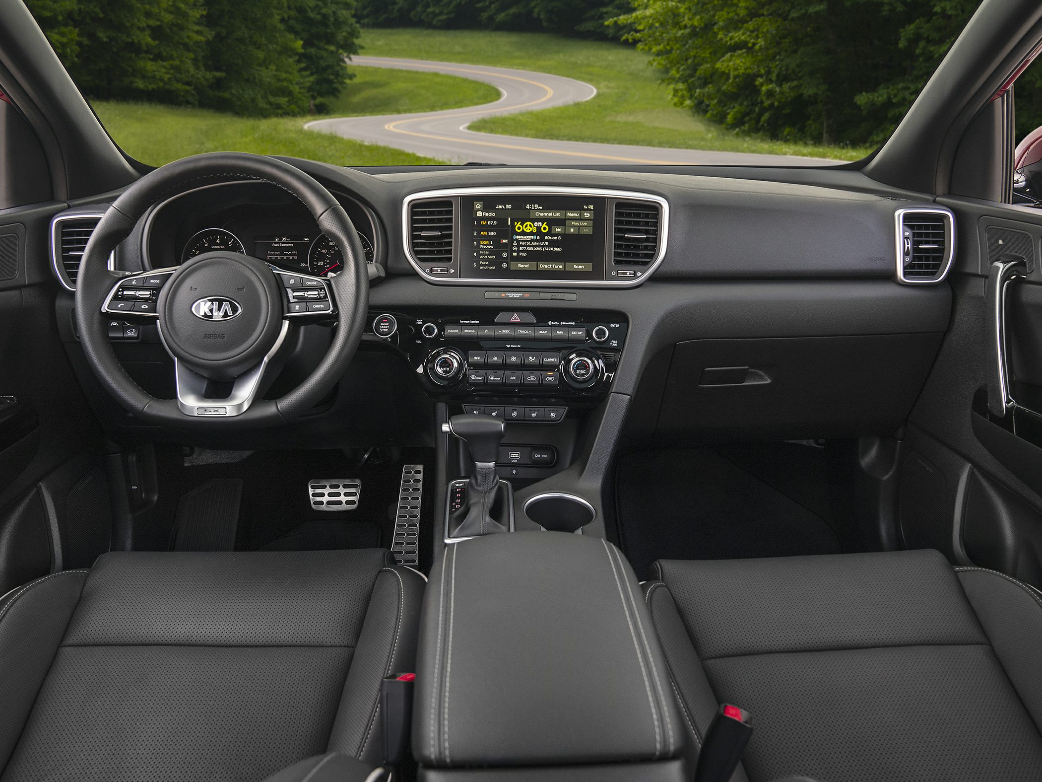 Dashboard and steering wheel with infotainment display and controls