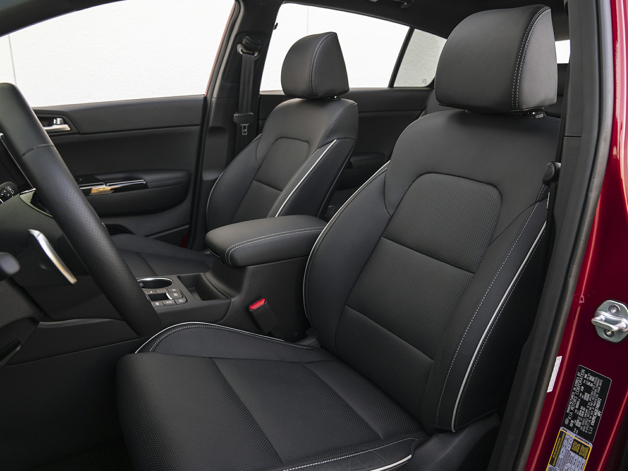 Ergonomic black front seats with detailed stitching