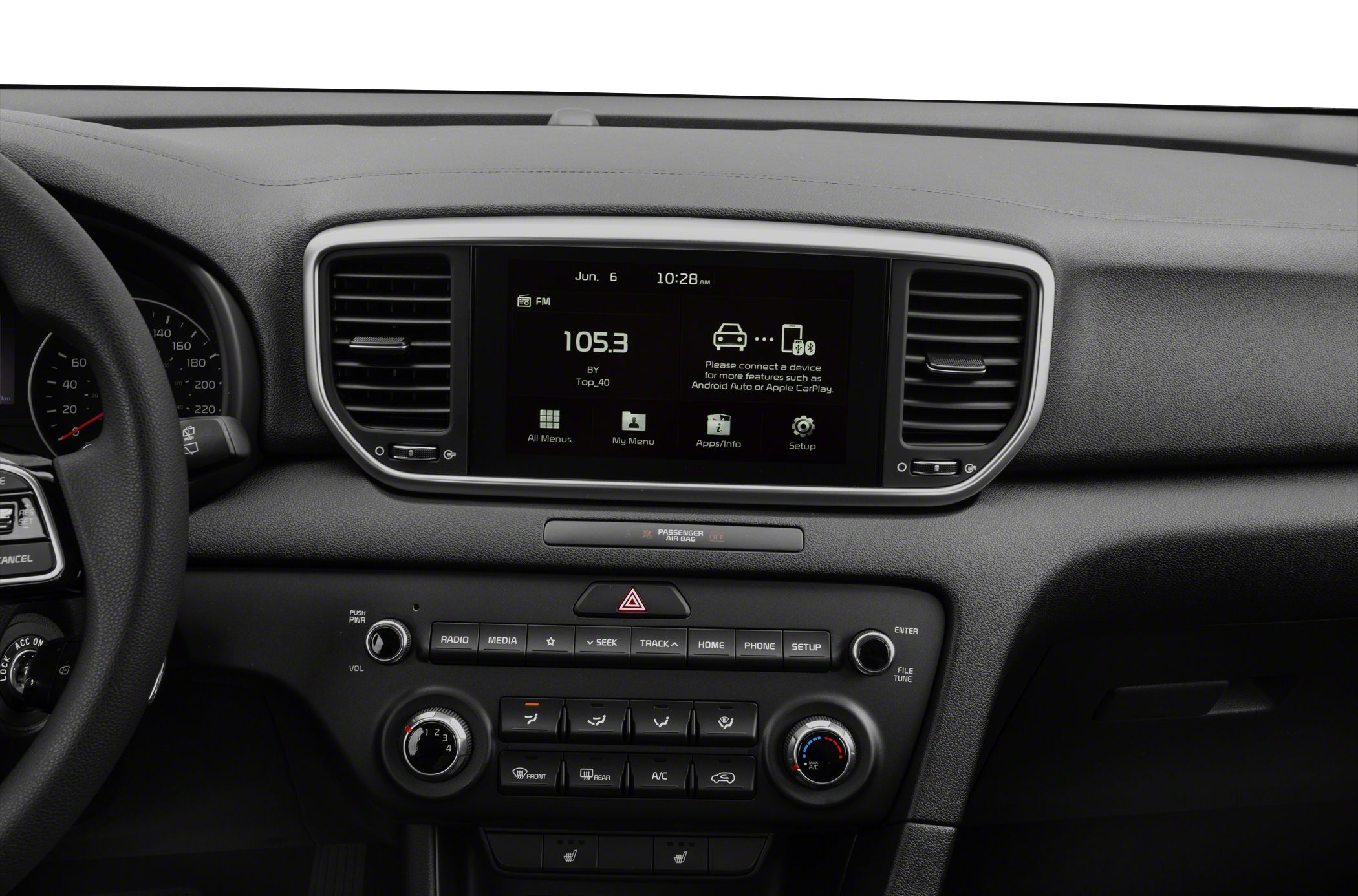 Infotainment screen with radio display and dashboard climate controls.
