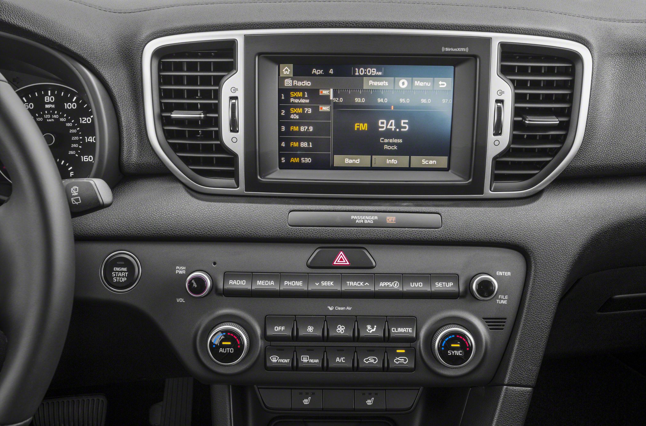 Car infotainment system with climate control, push start button, and dashboard vents
