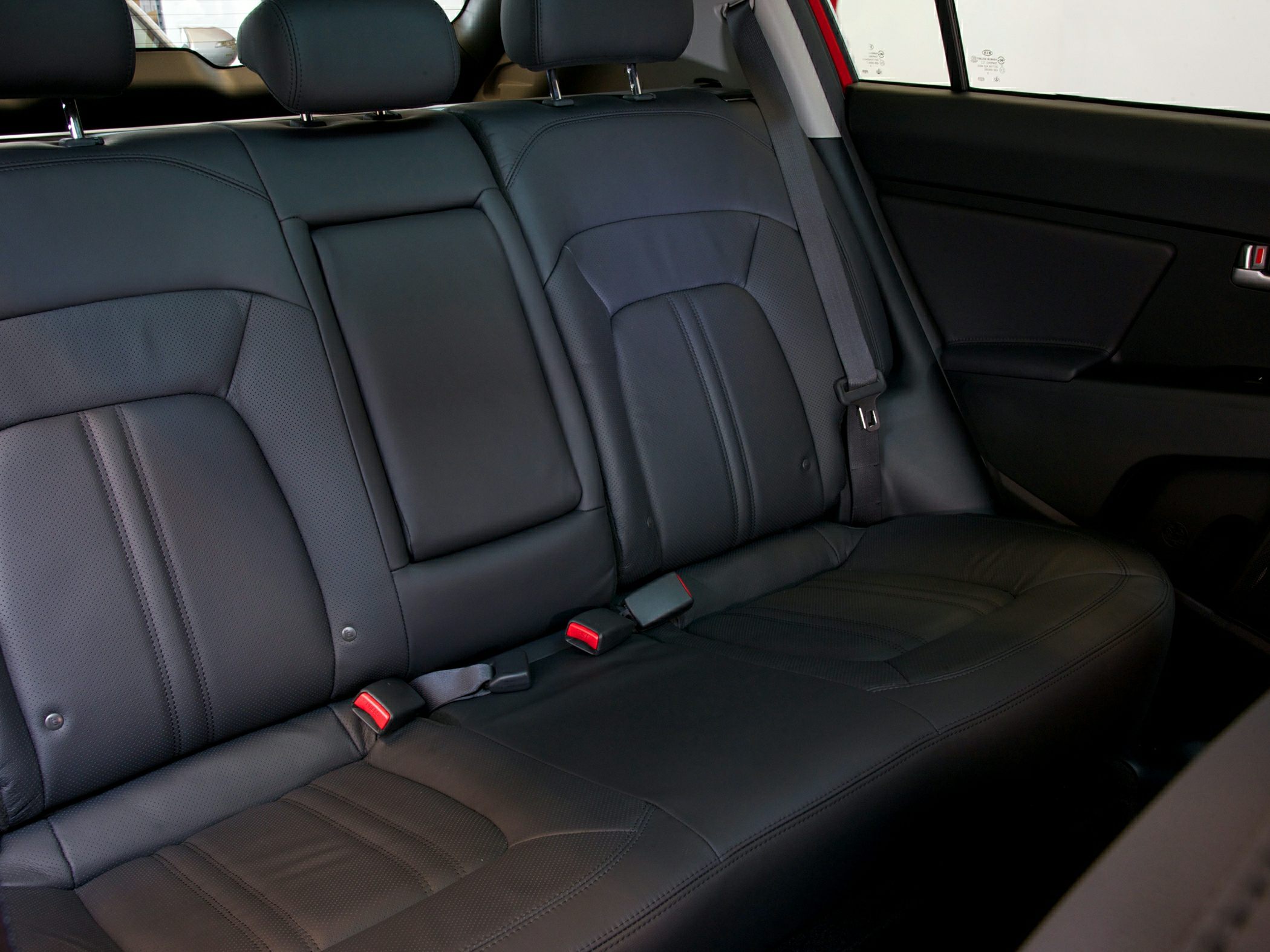 Black leather rear seats with headrests and seat belts