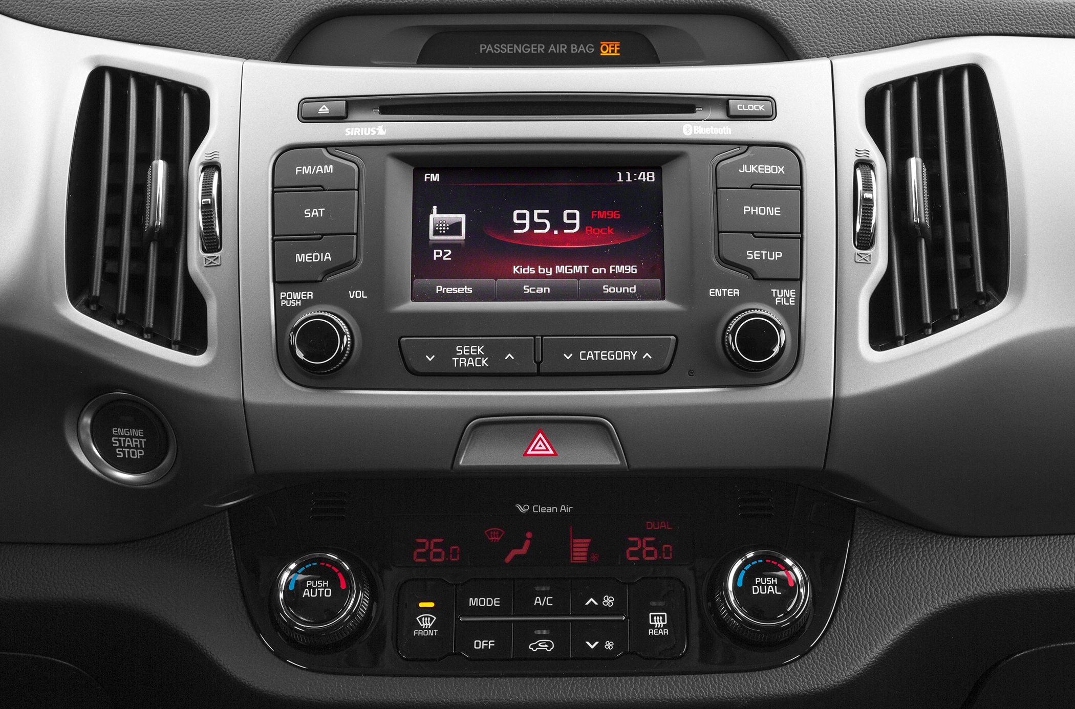 Car dashboard with audio system and dual-zone climate control
