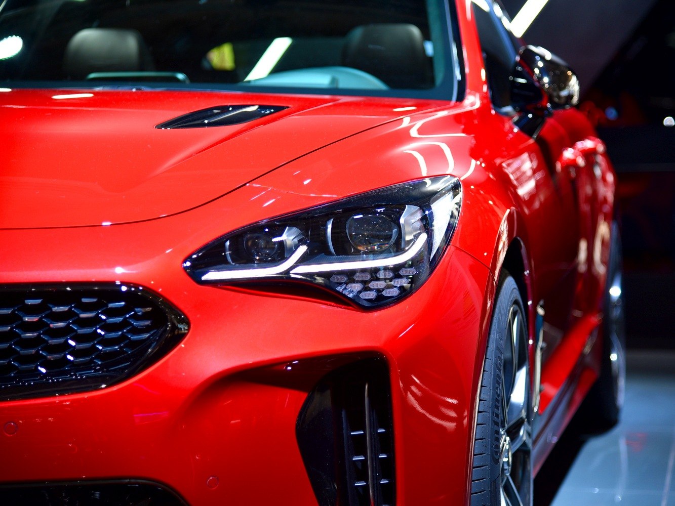 Front view with LED headlights, grille, and aerodynamic hood vent