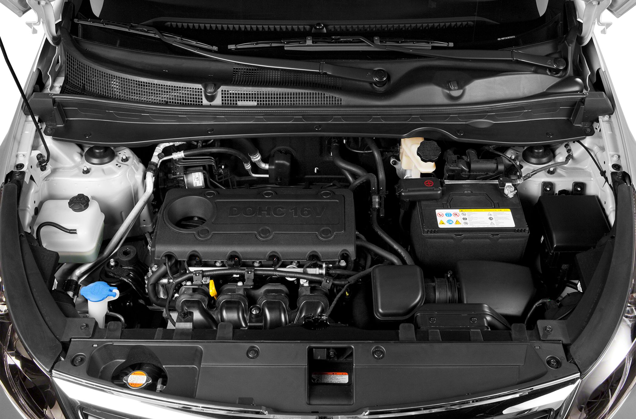 Close-up of DOHC 16V engine and components in a vehicle engine bay