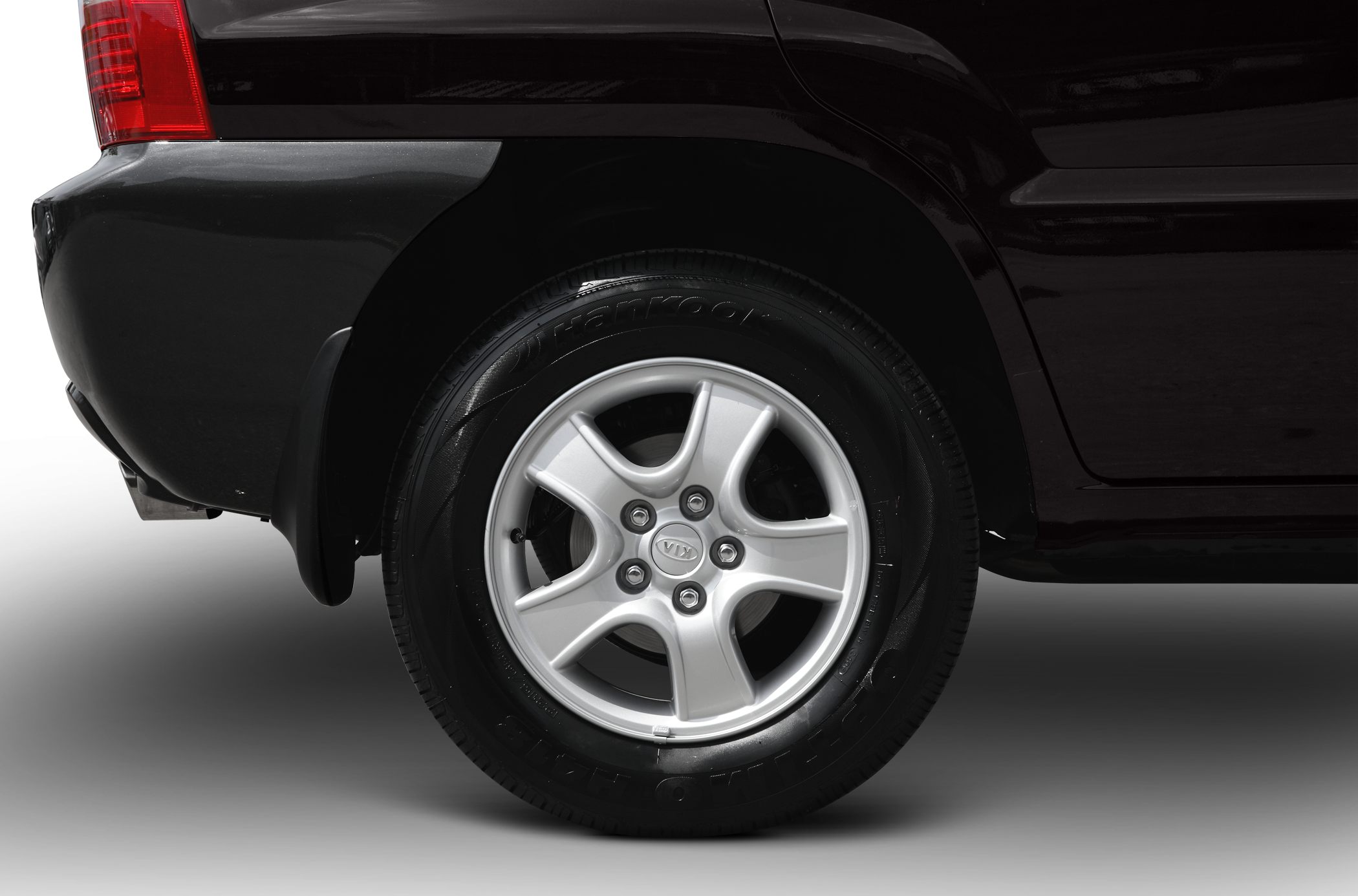 Rear alloy wheel and tire close-up with visible tread and rim design