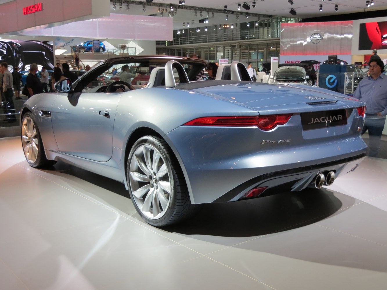 Rear view of a sleek convertible with dual exhaust and silver finish