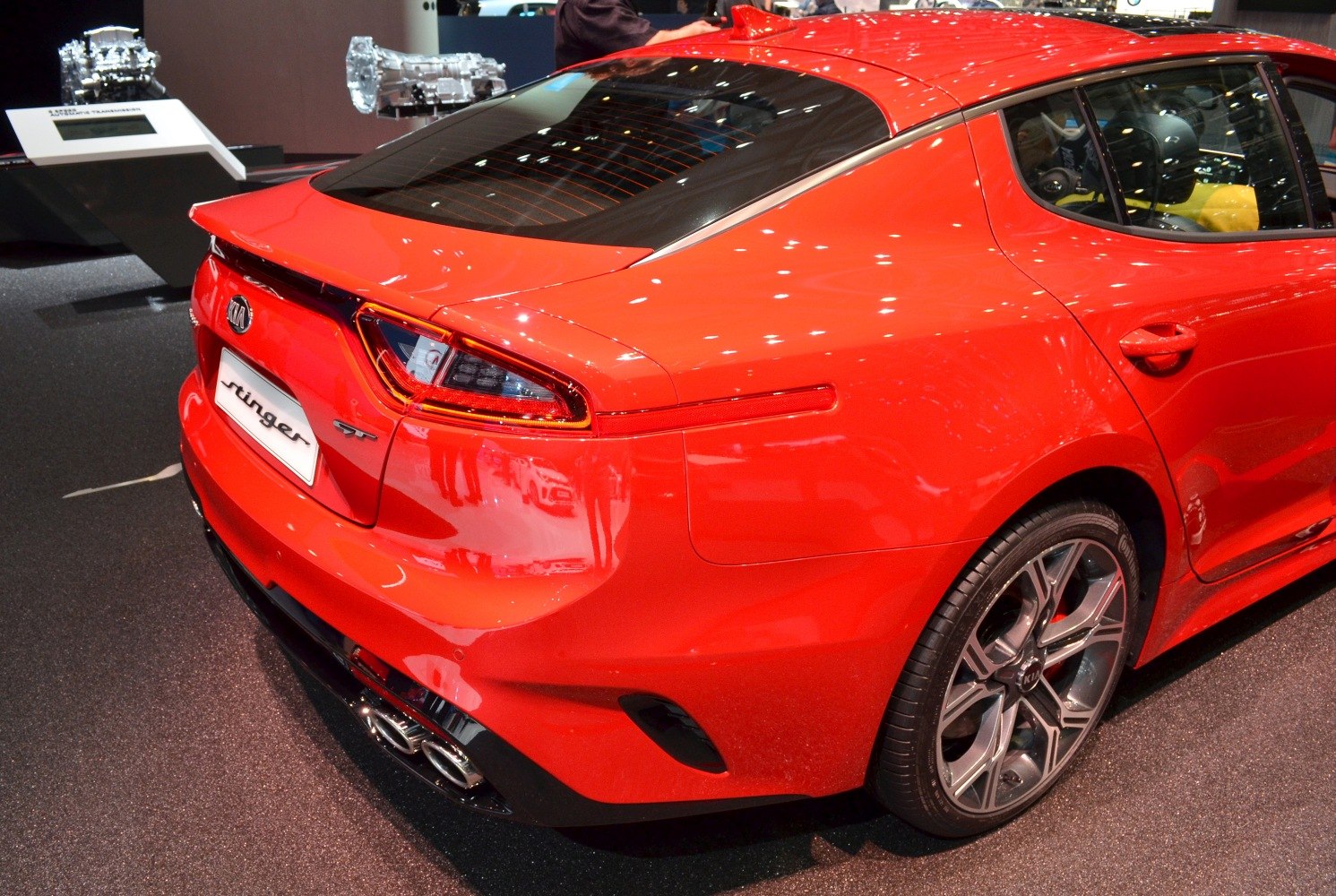 Rear sporty tail lights and quad exhaust pipes on a hatchback.