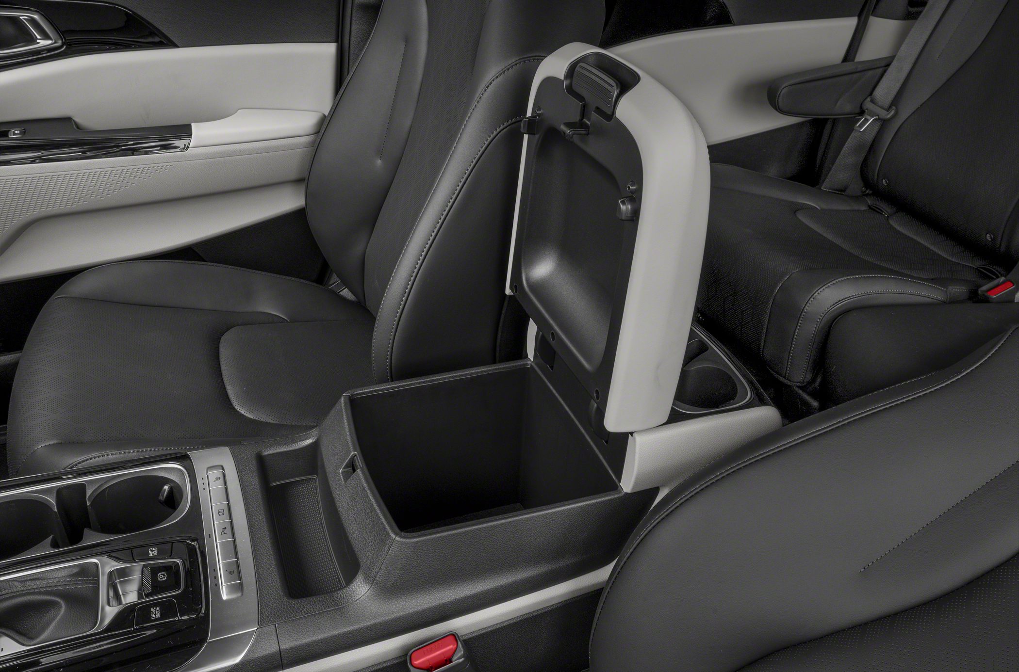 Center storage console with open lid and black seating upholstery