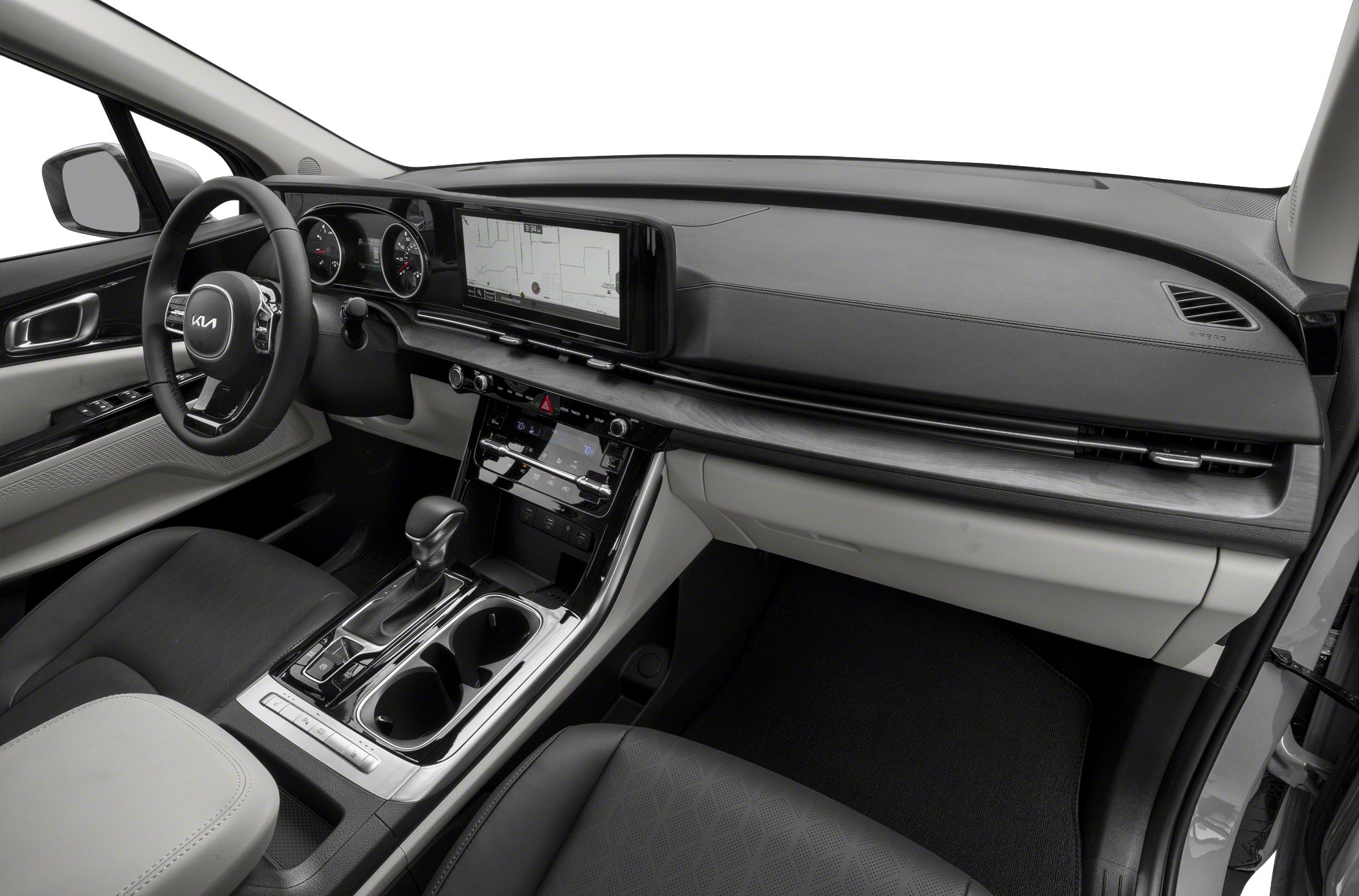 Modern digital dashboard and center console with gear shift and steering wheel.