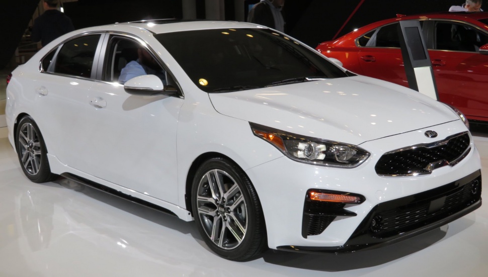 White sedan showing front side with LED headlights and sporty rims