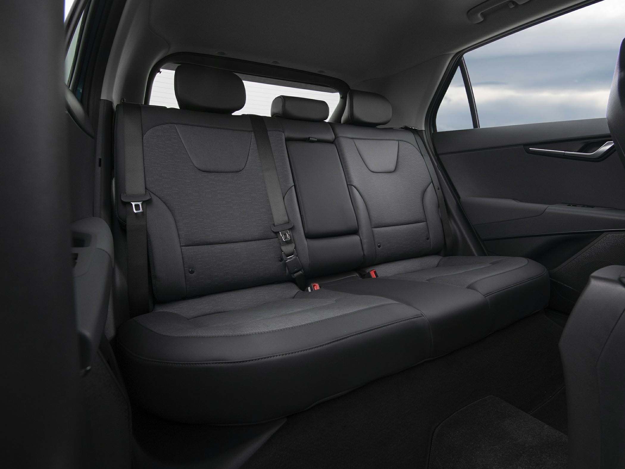 Spacious rear passenger seat with ergonomic headrests and premium upholstery