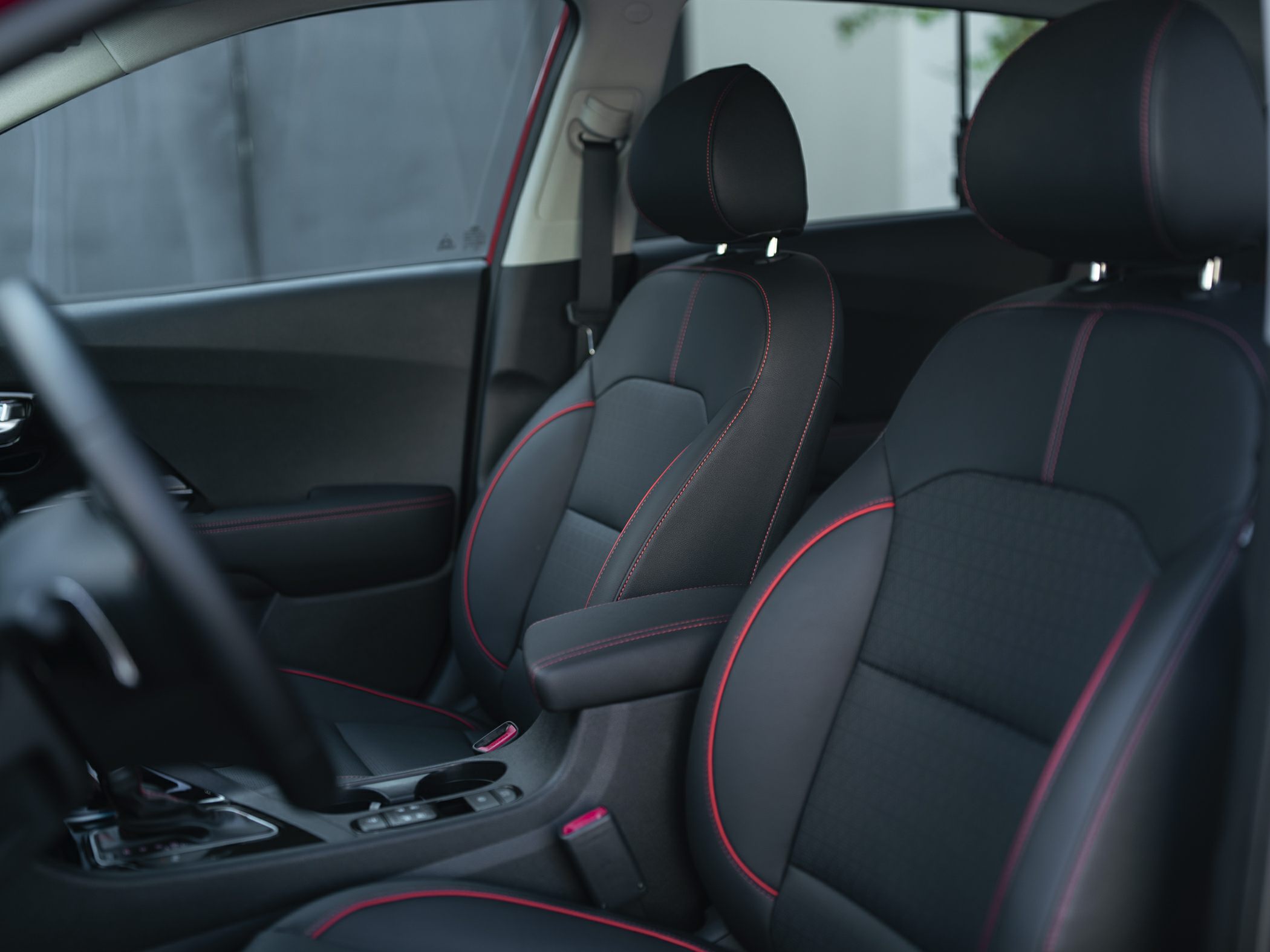 Black front seats with red stitching and center console