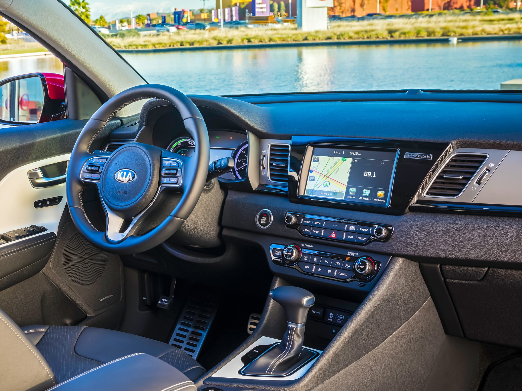 Steering wheel with controls, digital dashboard, center infotainment console