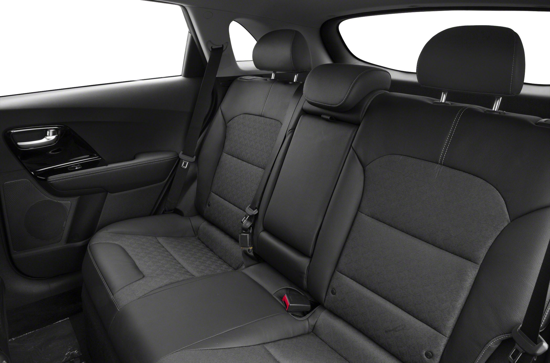 Rear seat interior with mixed fabric and leather upholstery and integrated safety seat belts.
