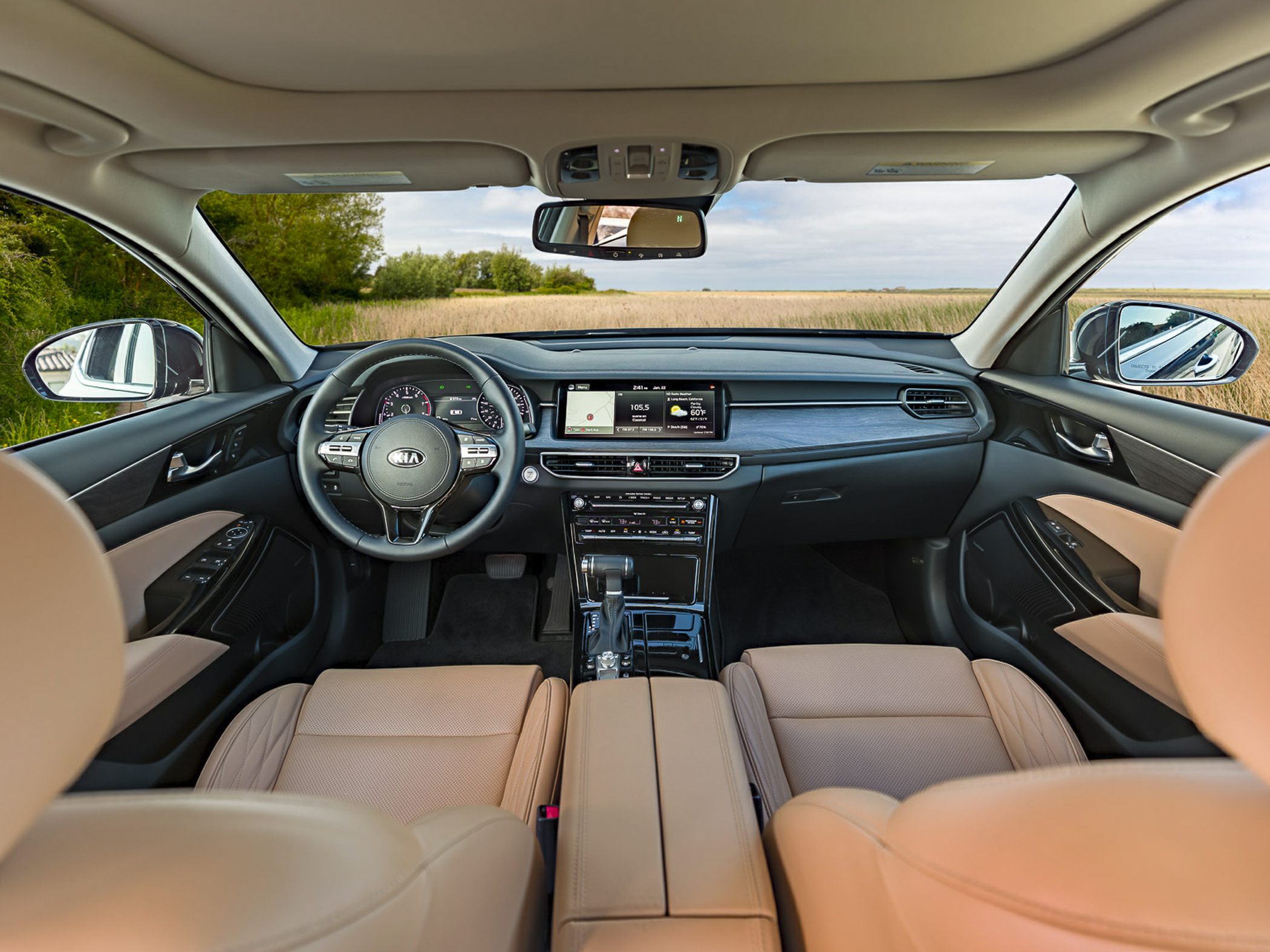 Interior dashboard, steering wheel, and touchscreen infotainment