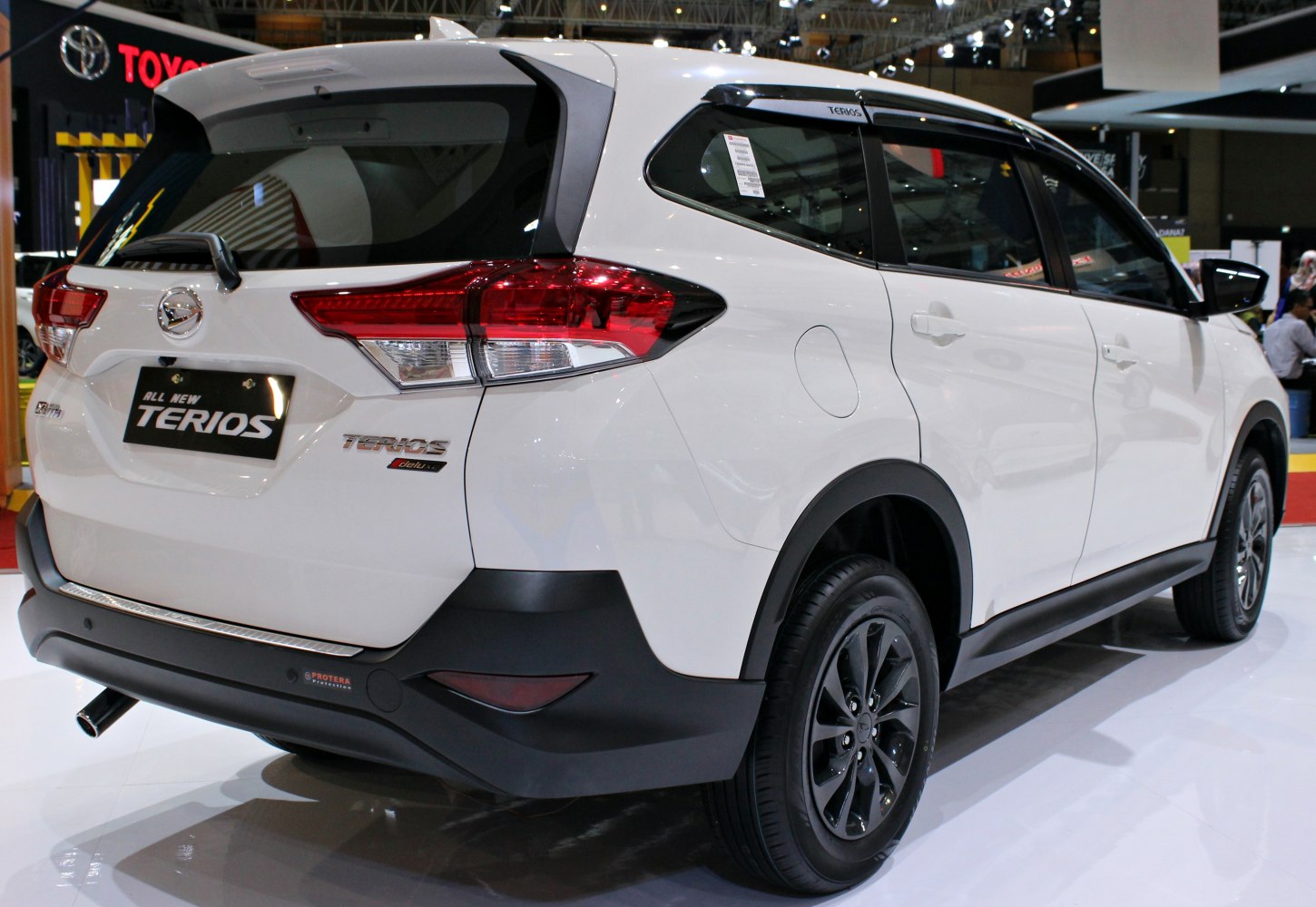 Rear and side view with taillights and black wheel arches