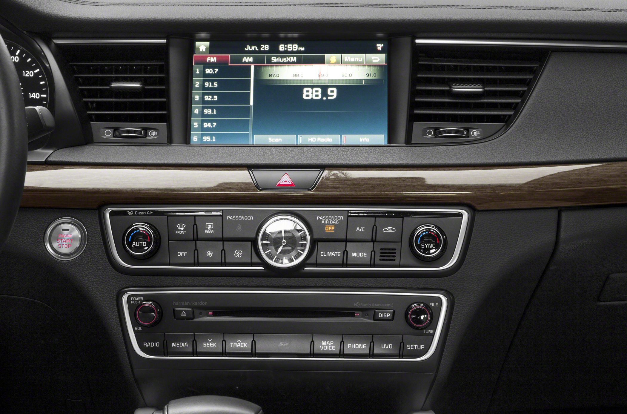 Digital multimedia screen with climate control and wooden trim dashboard