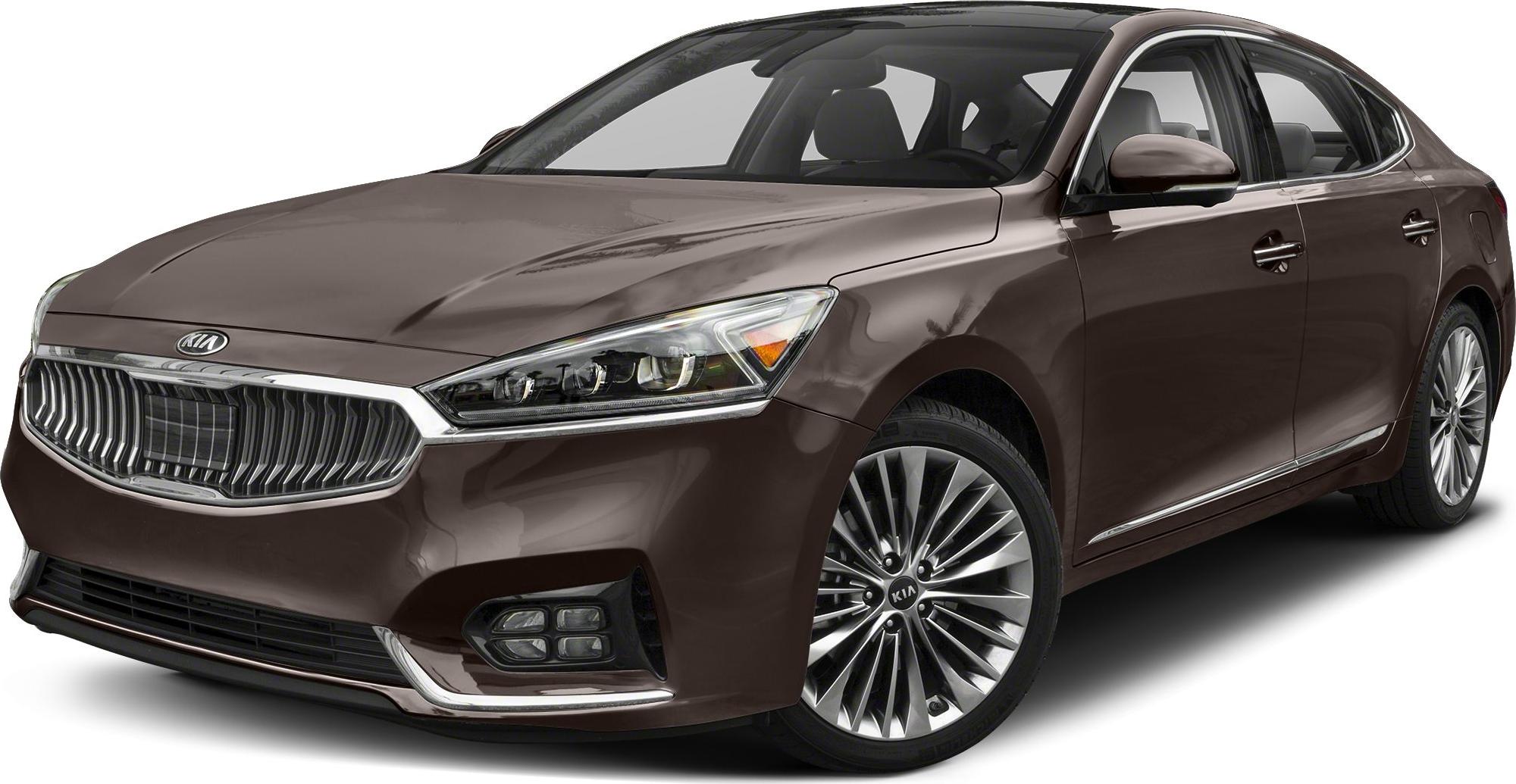 Luxury sedan front three-quarter view with distinctive grille and alloy wheels