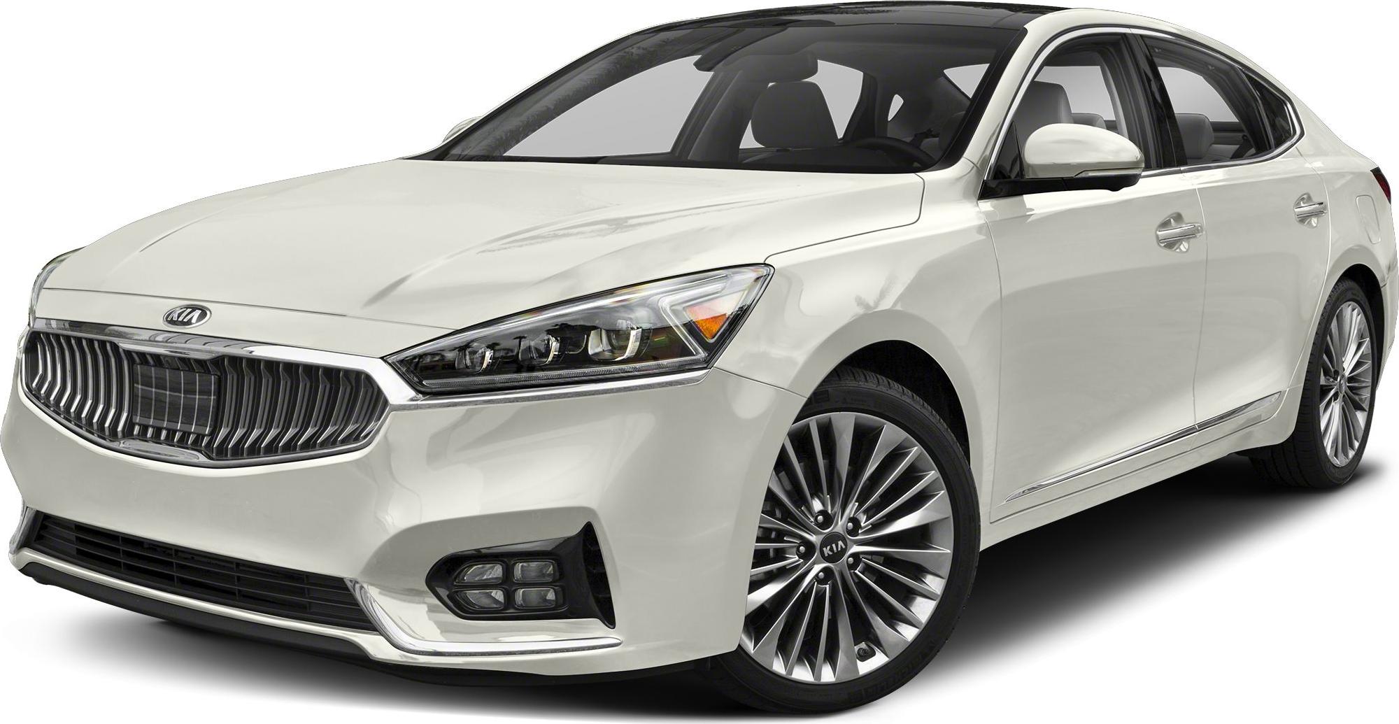 White sedan showing front grille and headlight details