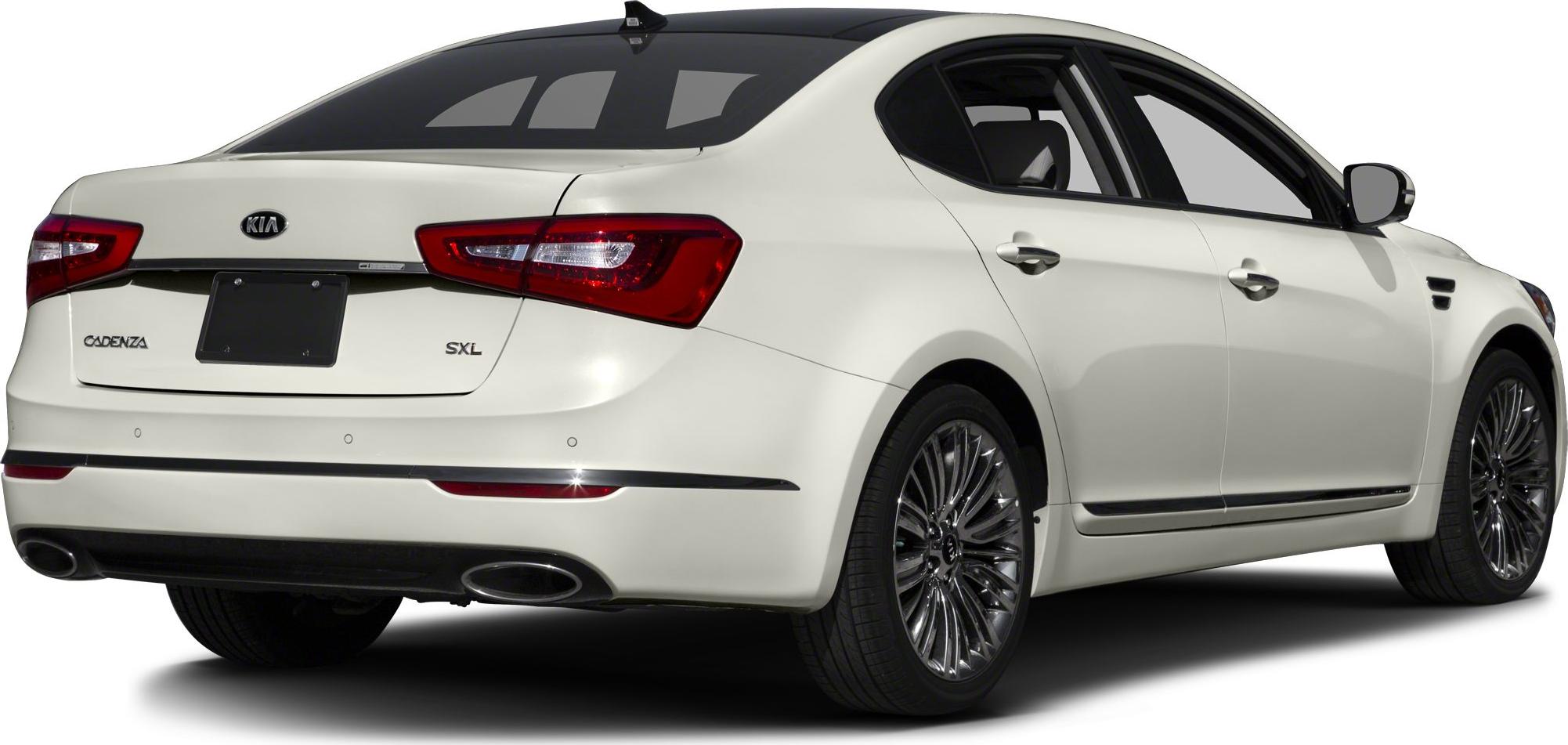 Rear view of a white sedan with dual exhaust and stylish alloy wheels