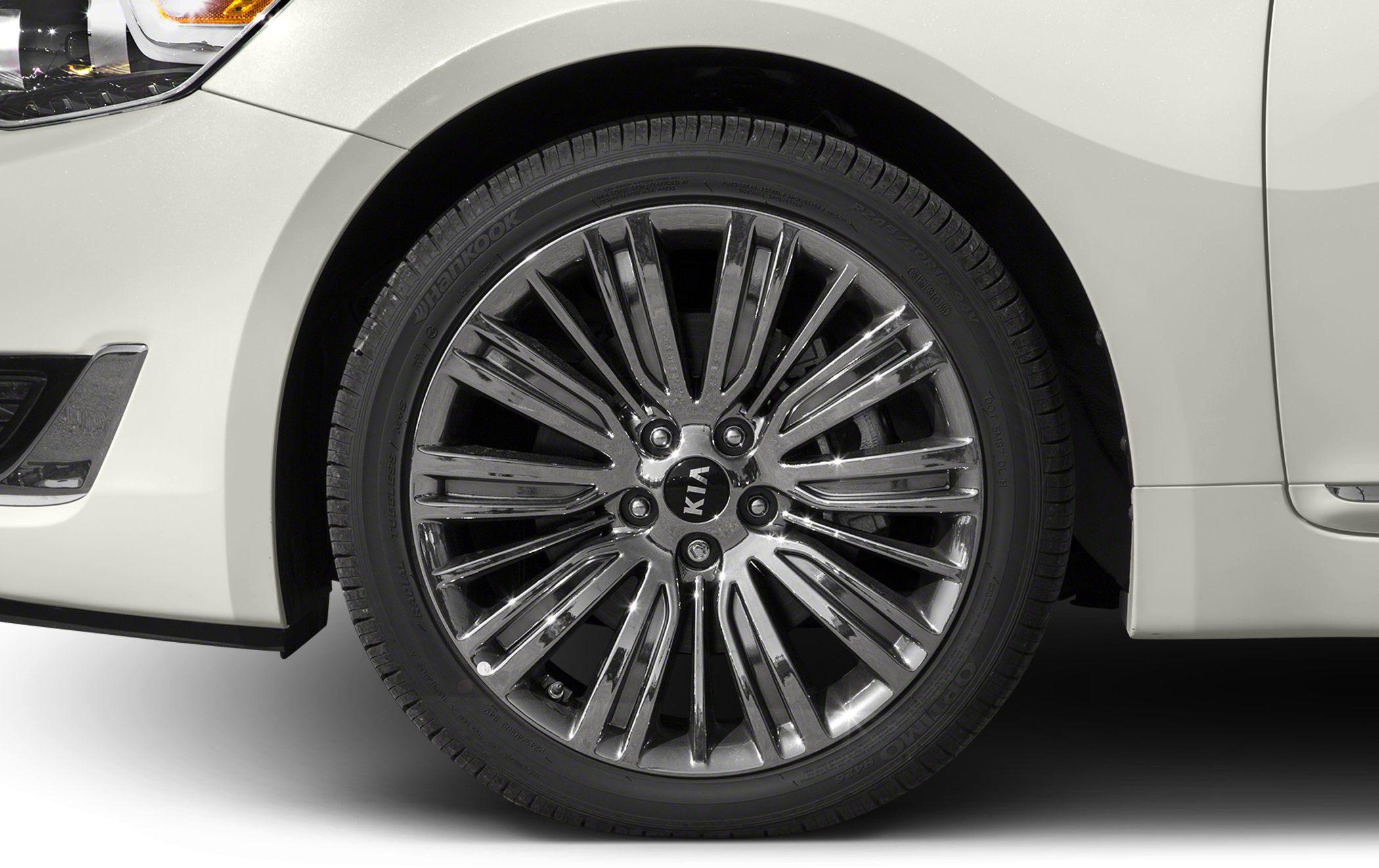Multi-spoke alloy wheel with Hankook tire on car front side