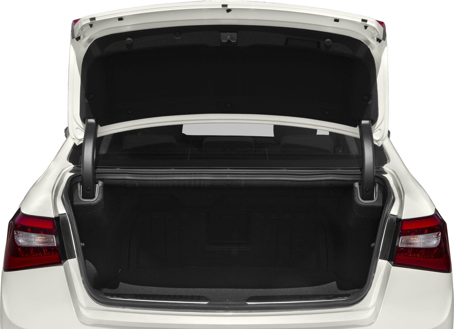 Open trunk view with rear taillights and storage space of a sedan.