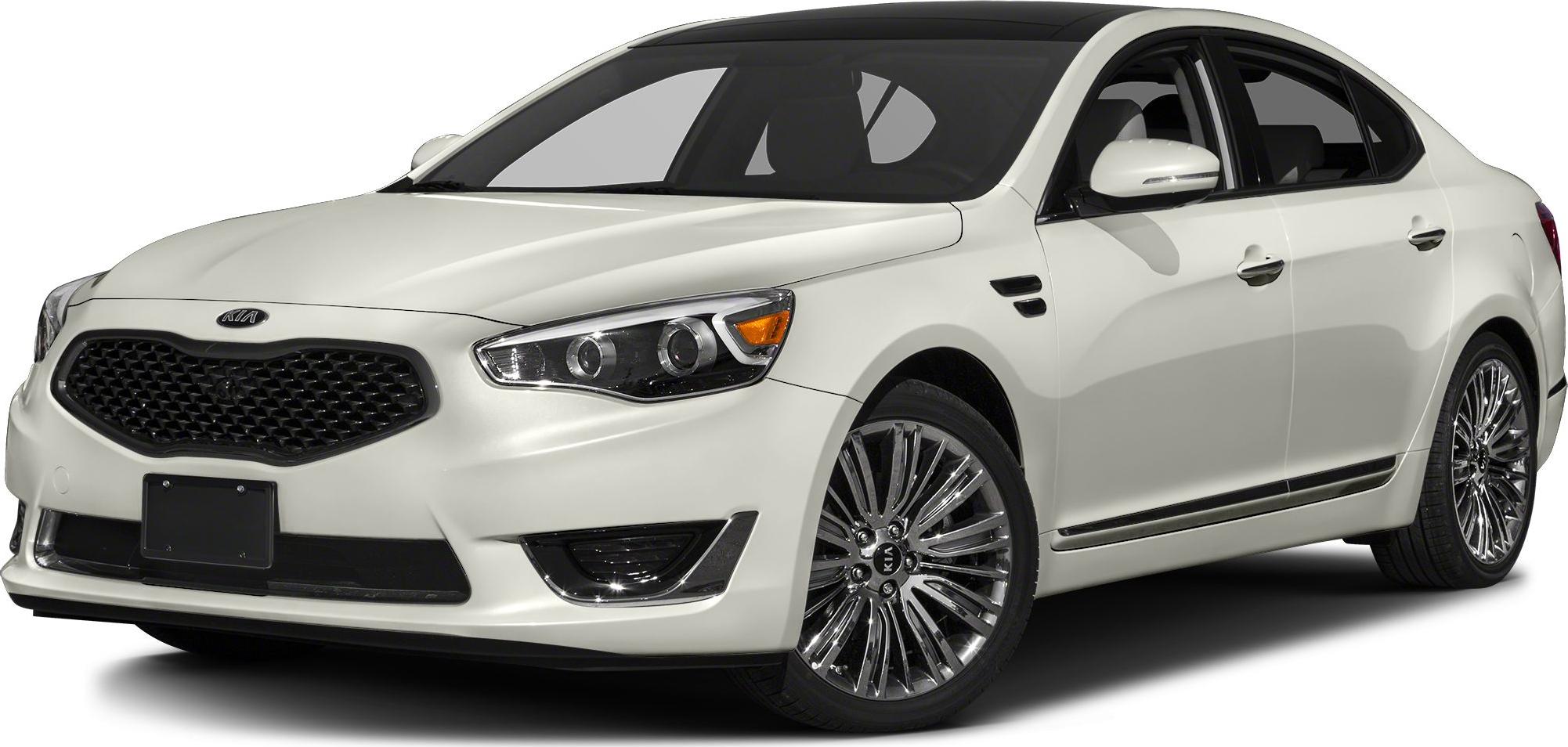 Front side view with signature grille and chrome multi-spoke wheels.
