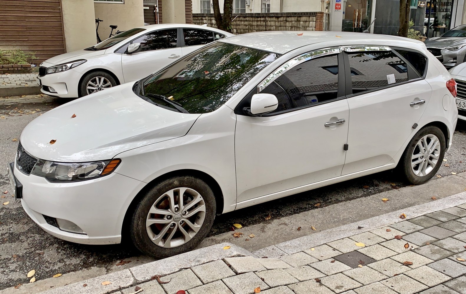 White hatchback with alloy wheels and sleek side profile