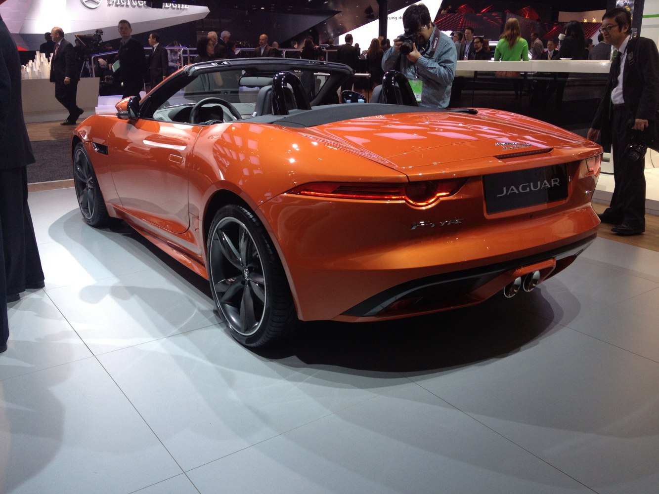Rear and side view of a convertible with distinctive tail lights and dual exhausts