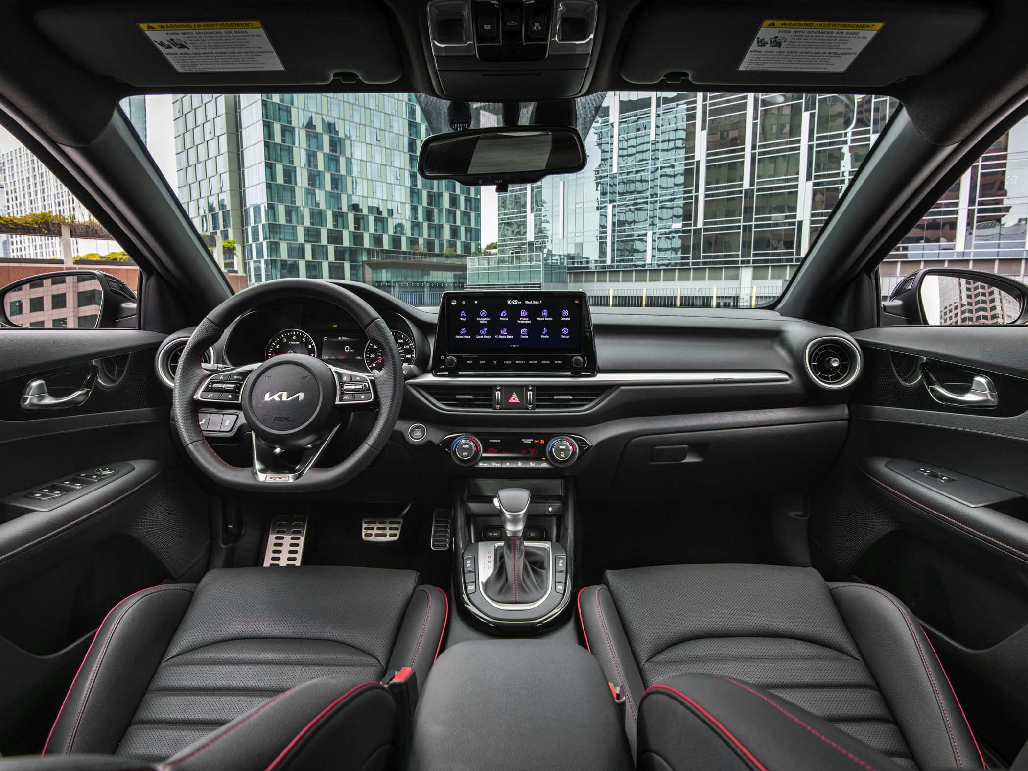 Digital instrument cluster and infotainment touchscreen in modern car interior