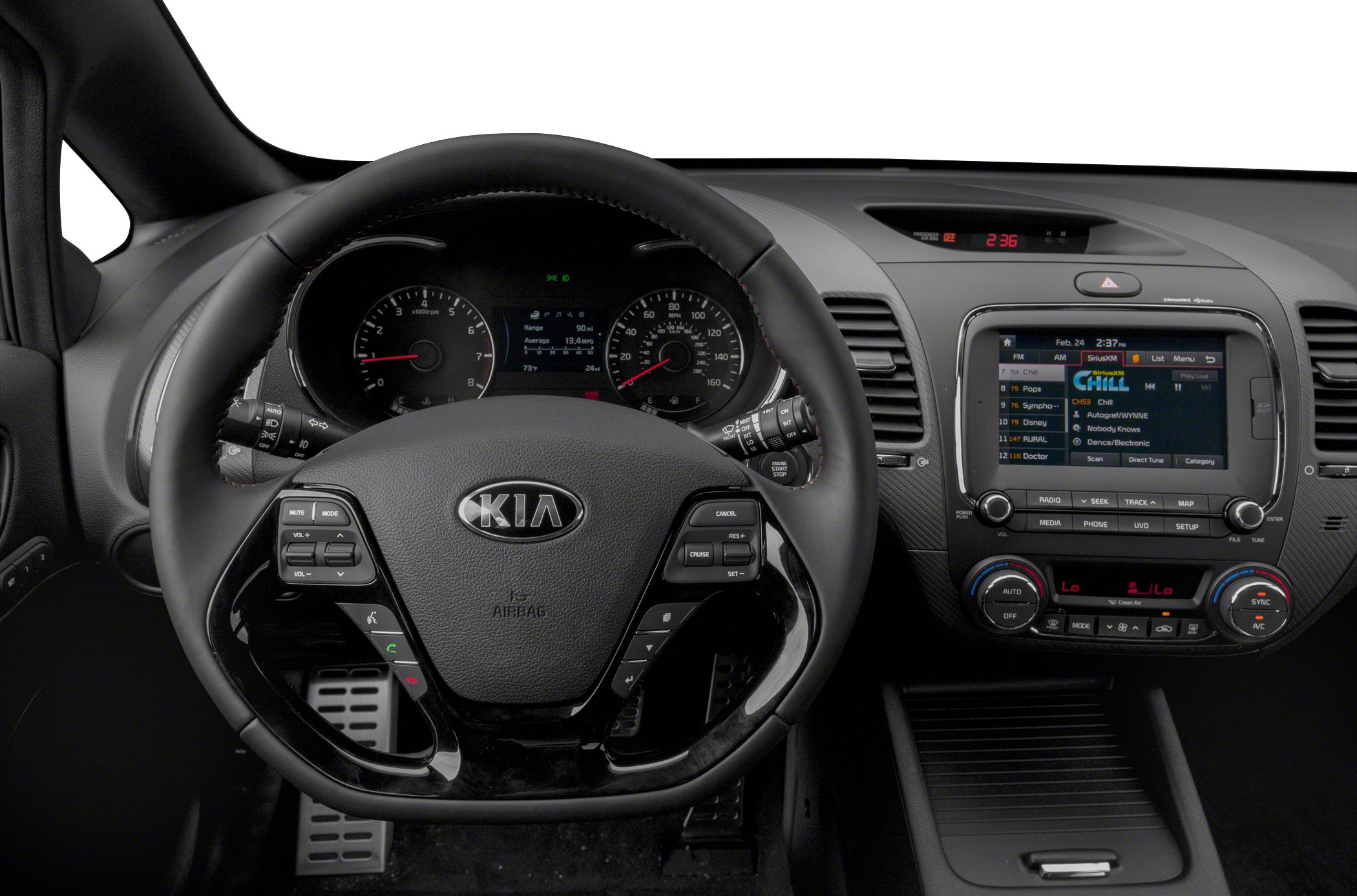 Steering wheel with control buttons and digital dashboard display.