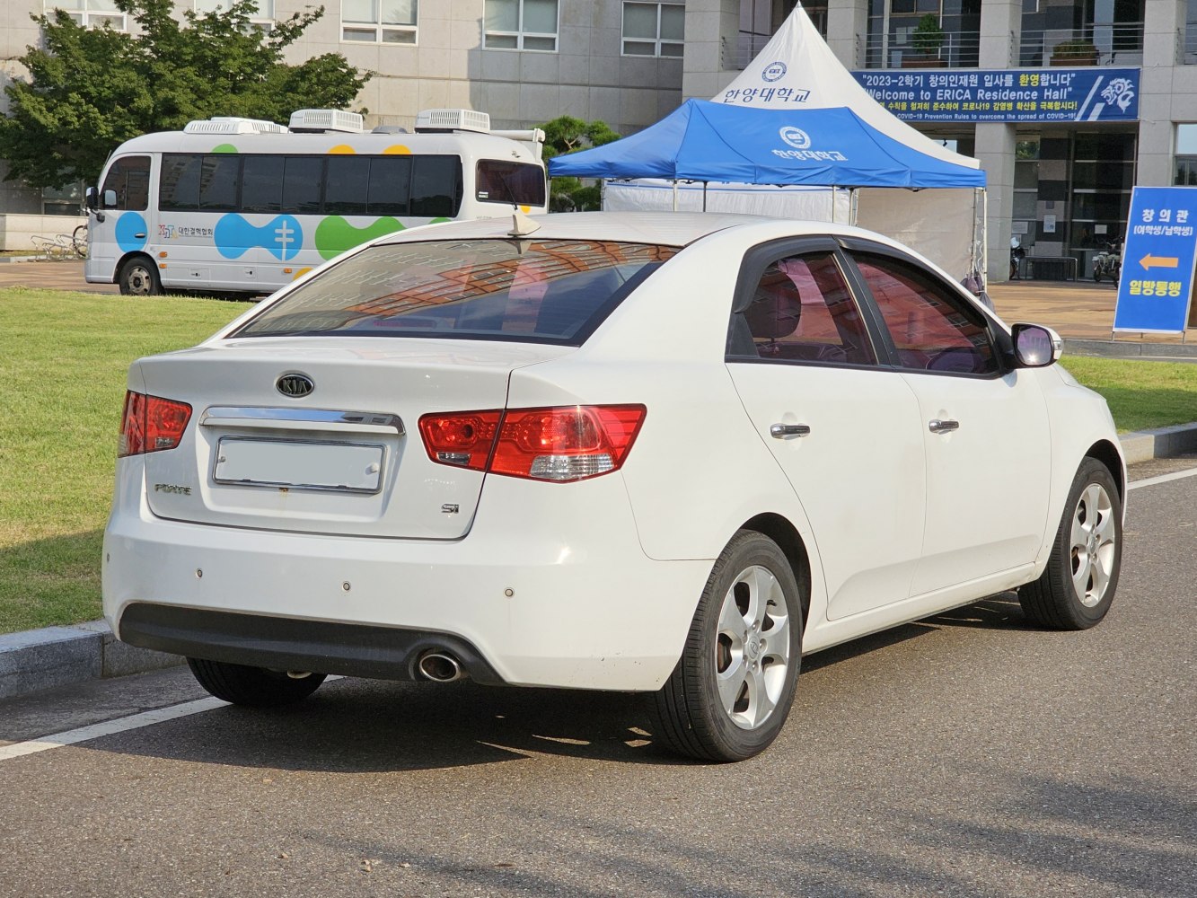 Rear view of a compact sedan with distinctive taillights and alloy wheels