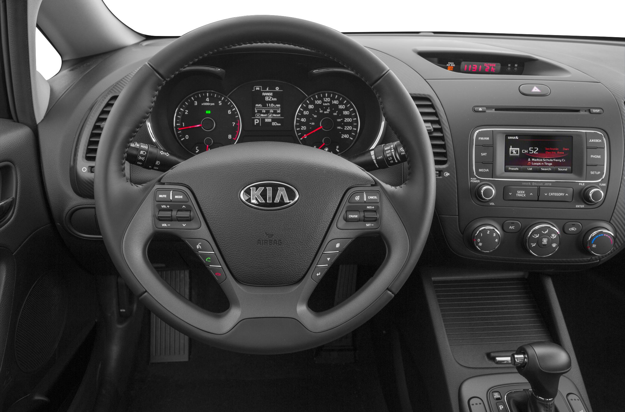 Steering wheel, dashboard, instrument cluster, radio interface, climate control knobs.