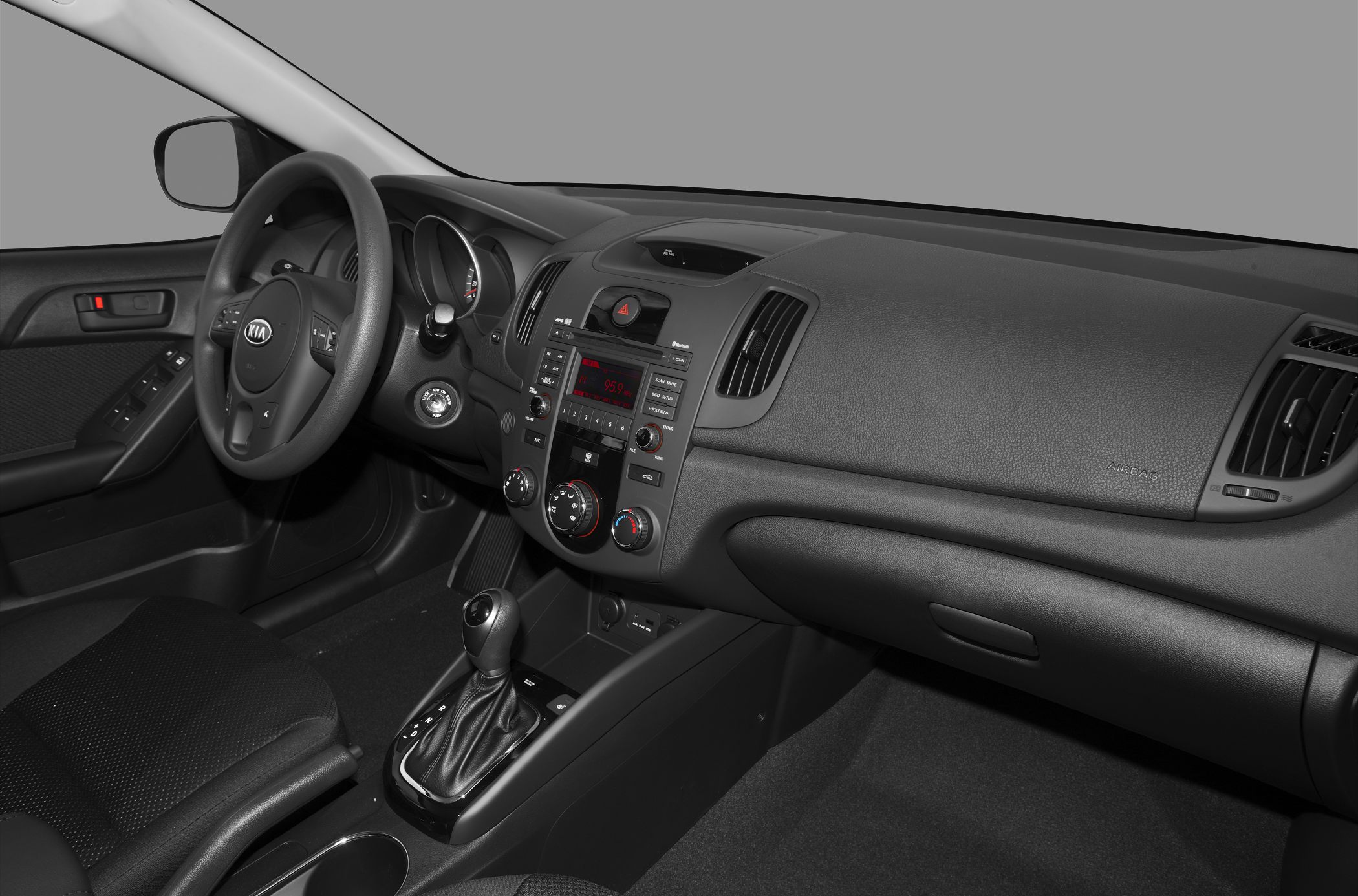 Interior dashboard and steering wheel with automatic gear shift and control layout