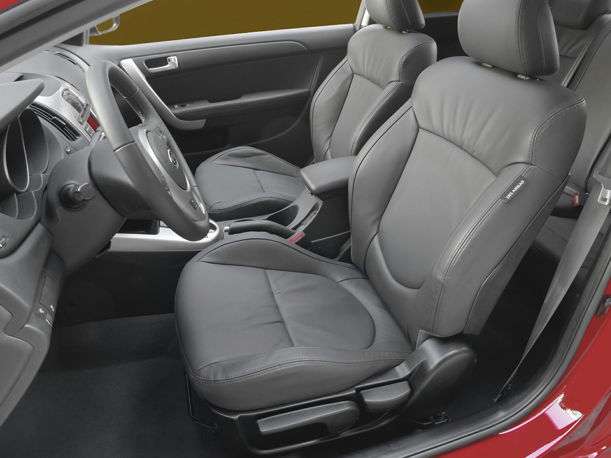 Leather front seats and steering wheel in car interior