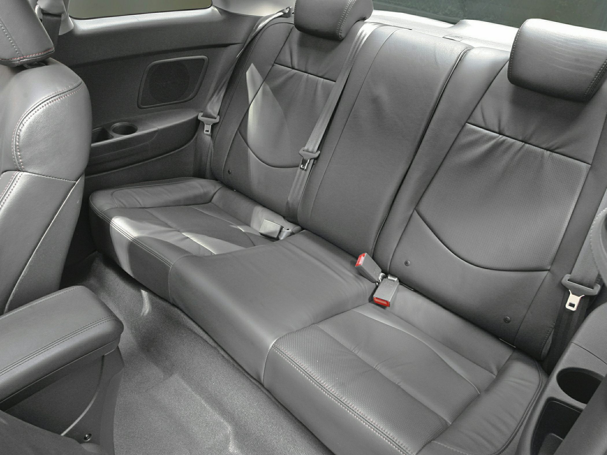 Rear leather seats with stitching and integrated seat belts