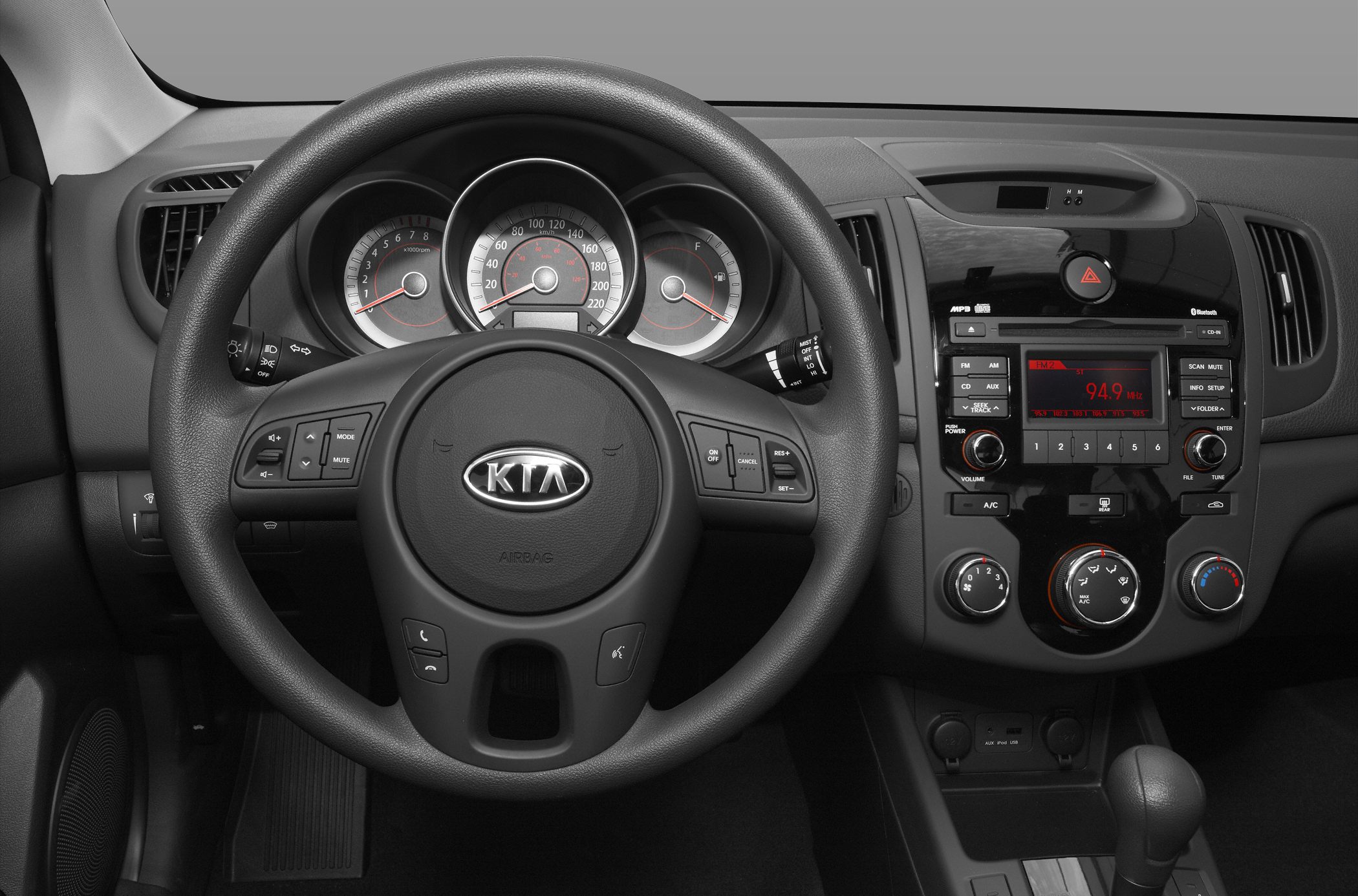 Steering wheel, instrument cluster, and dashboard controls